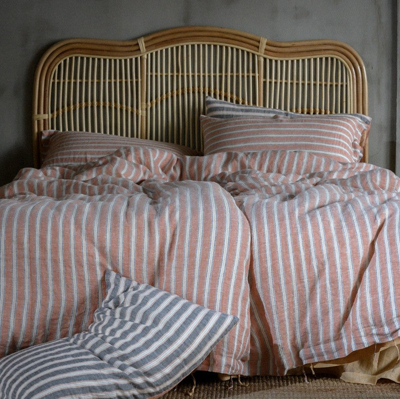 PeachPuff Vertical Stripes 100% Linen Duvet Cover Set on bed with pillows, breathable and soft for a cozy night's sleep