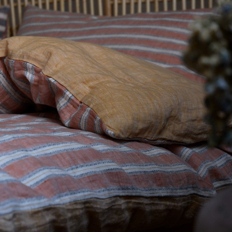 PeachPuff Vertical Stripes 100% Linen Duvet Cover Set with soft, breathable, pre-washed fabric on bed with striped pattern.