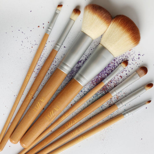 The Essential Brush Set featuring eight high-quality vegan makeup brushes designed for flawless looks.
