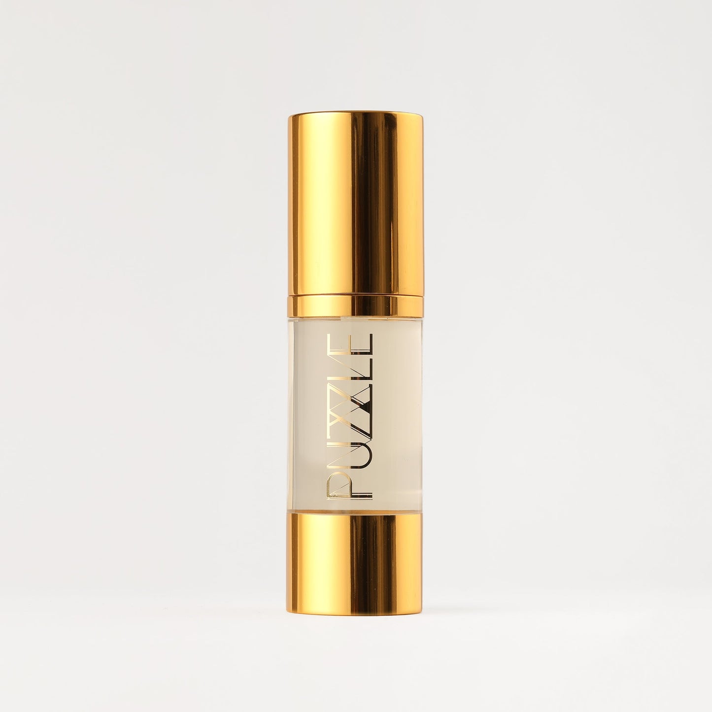 PUZZLE Makeup Remover in gold bottle for gentle, vegan makeup removal