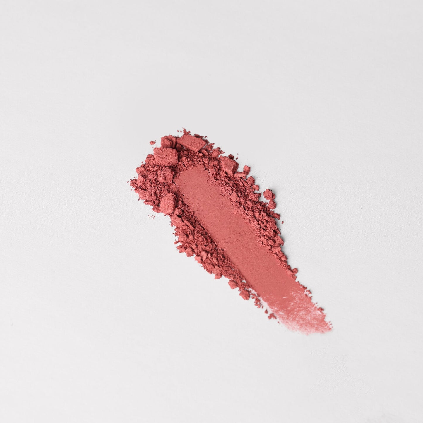 Blush vegan blendable powder swatch in a pink shade for customizable palettes.