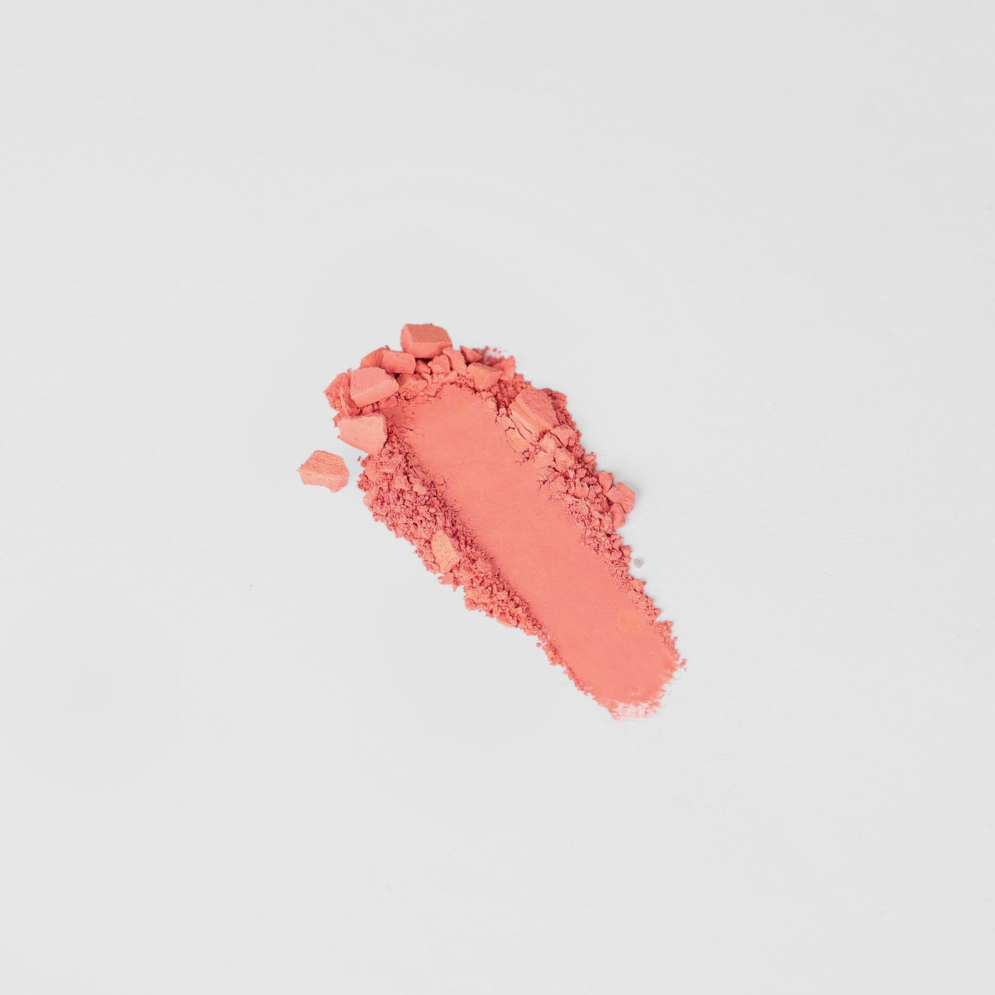 Dreamy vegan Blush in a vibrant coral shade, perfect for customizable palettes and any skin tone. Blendable and buildable.