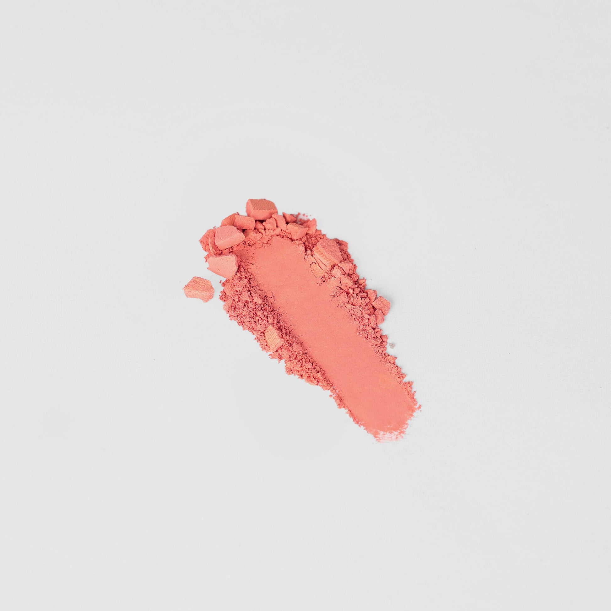 Dreamy vegan Blush in a vibrant coral shade, perfect for customizable palettes and any skin tone. Blendable and buildable.