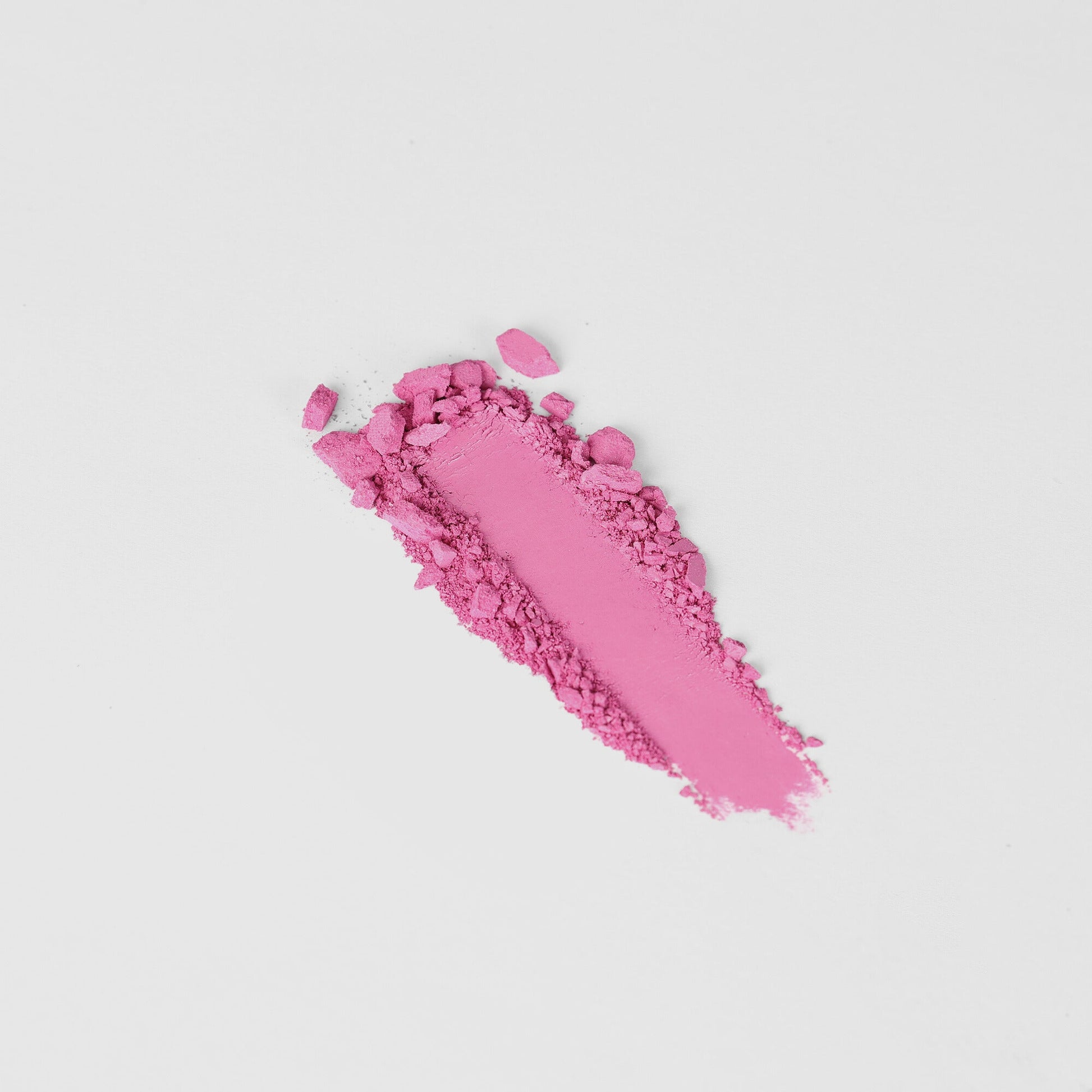 Pink vegan Blush powder for a pop of color in a magnetic palette, blendable and buildable for any skin tone, product photography.