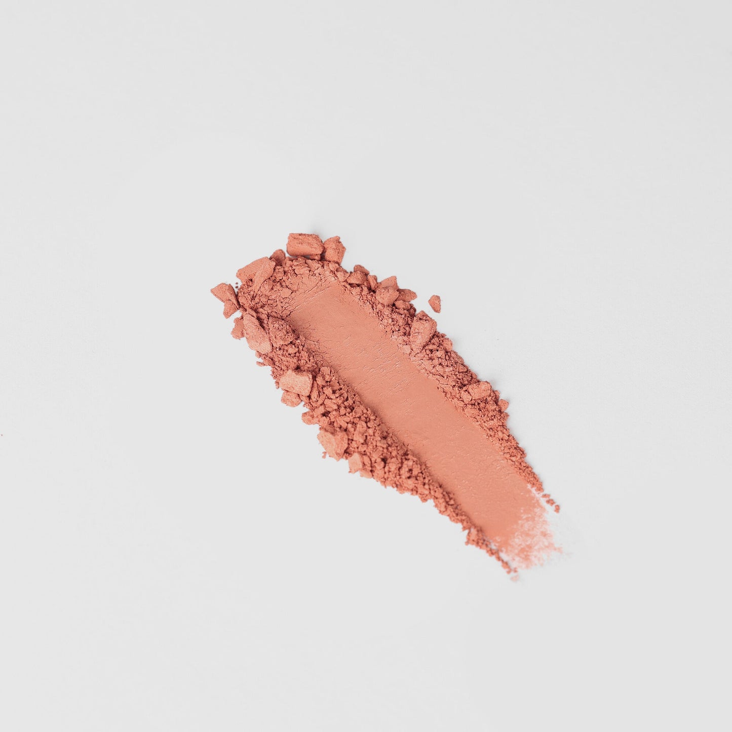 Blush powder swipe showcasing vegan blendable formula in a variety of shades for diverse skin tones and customizable palettes.