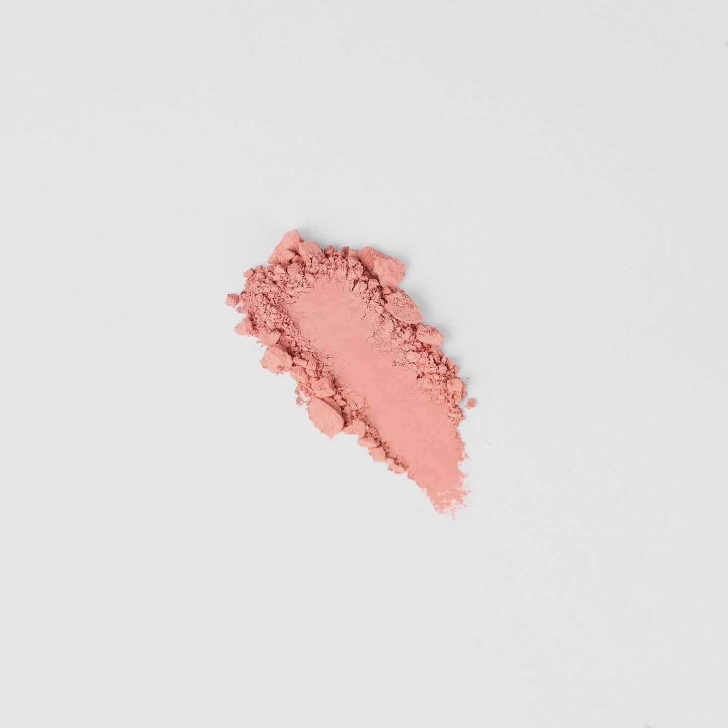 Blush - Vegan pink blush powder against white background, ideal for blendable color adjustments.