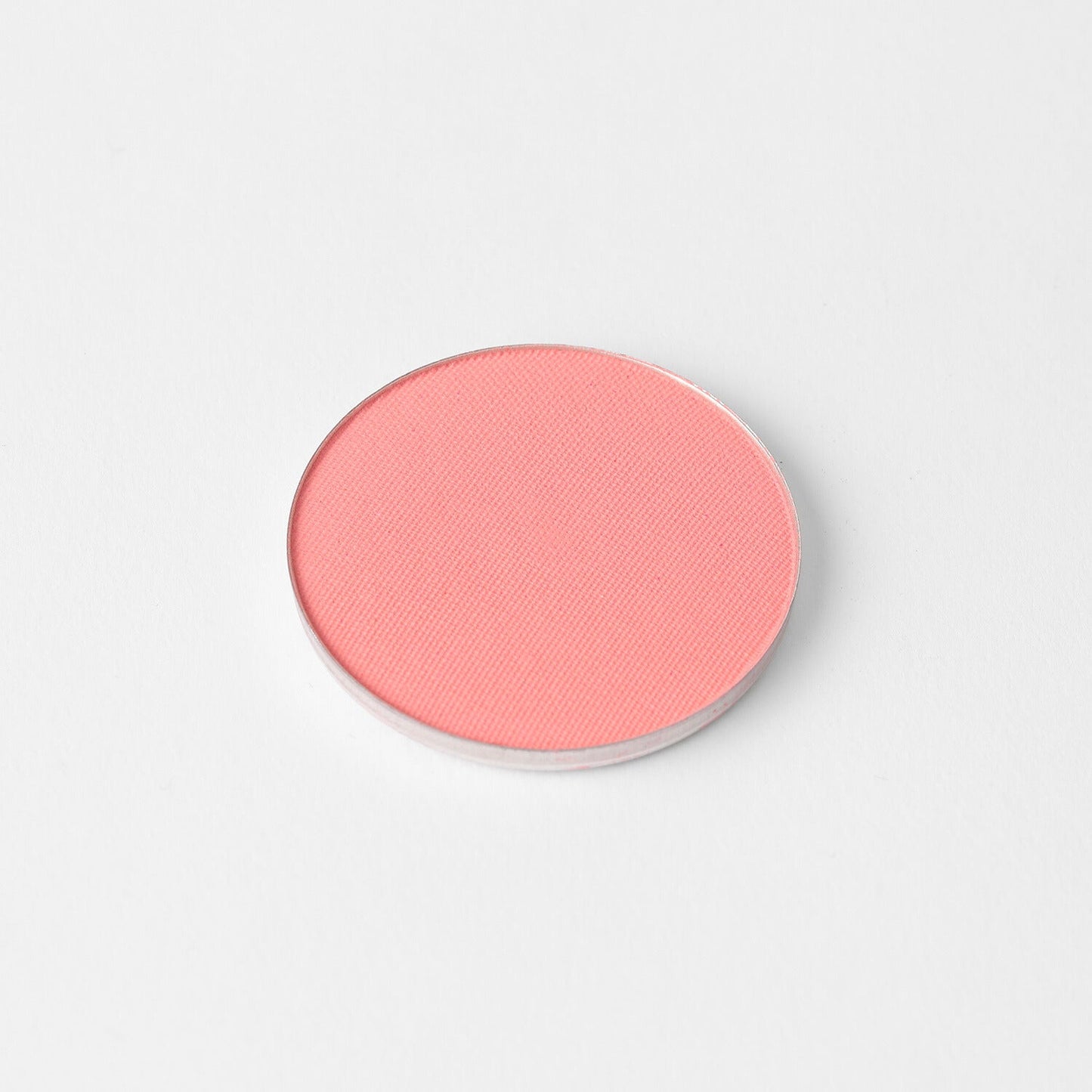 Blush in a pan, vegan and blendable, perfect for customizable palettes and suitable for all skin tones.