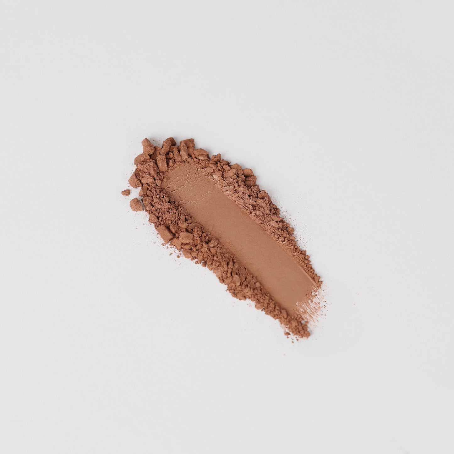 Bronzer swatch showcasing vegan formula with matte finish, perfect for a natural, sun-kissed glow or sculpted definition.