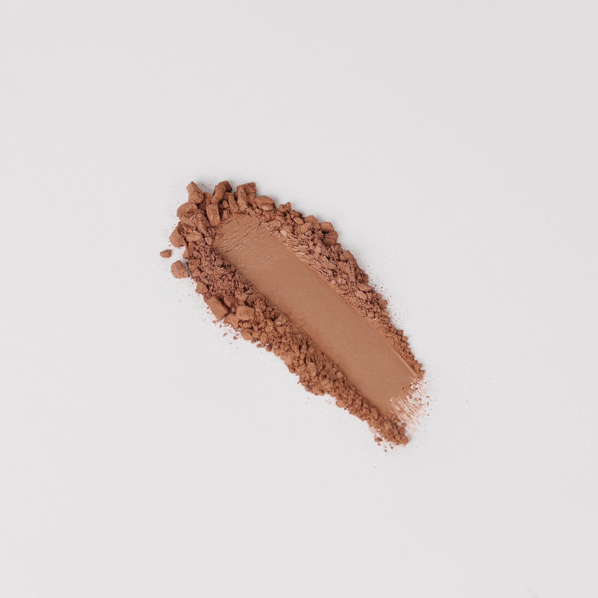 Bronzer swatch showcasing vegan formula with matte finish, perfect for a natural, sun-kissed glow or sculpted definition.