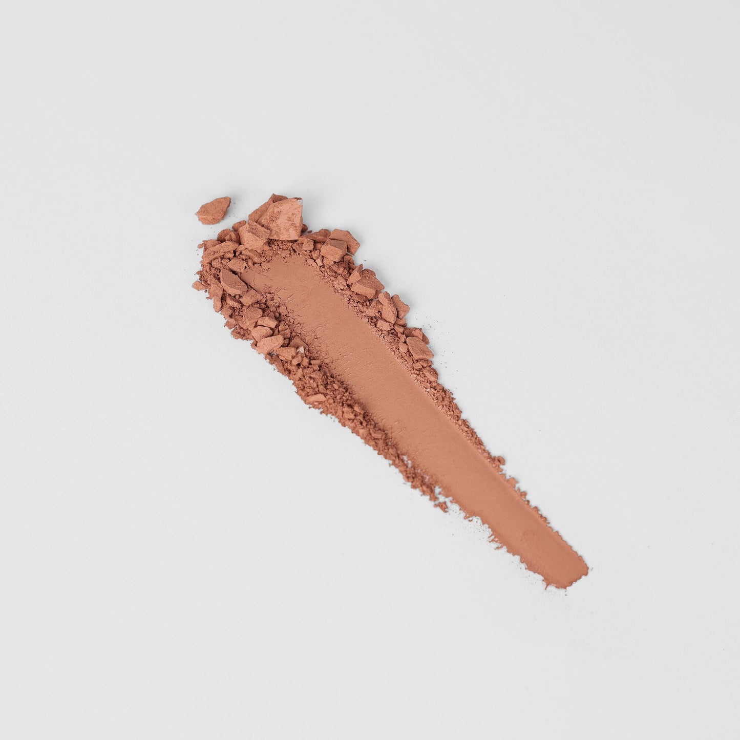 Bronzer swipe showing vegan formulation suitable for matte or shimmer finish, easily buildable for a natural glow.