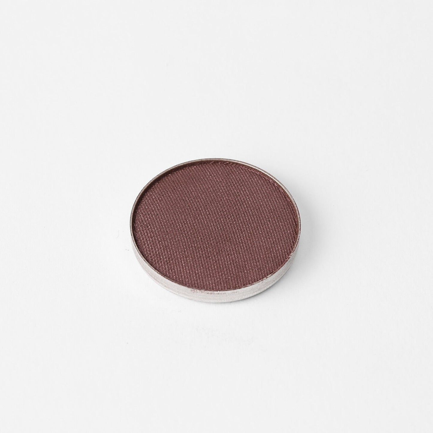 Glow Pressed Eyeshadow in pan showcasing a rich, vegan pigment for shimmering, buildable eye looks.