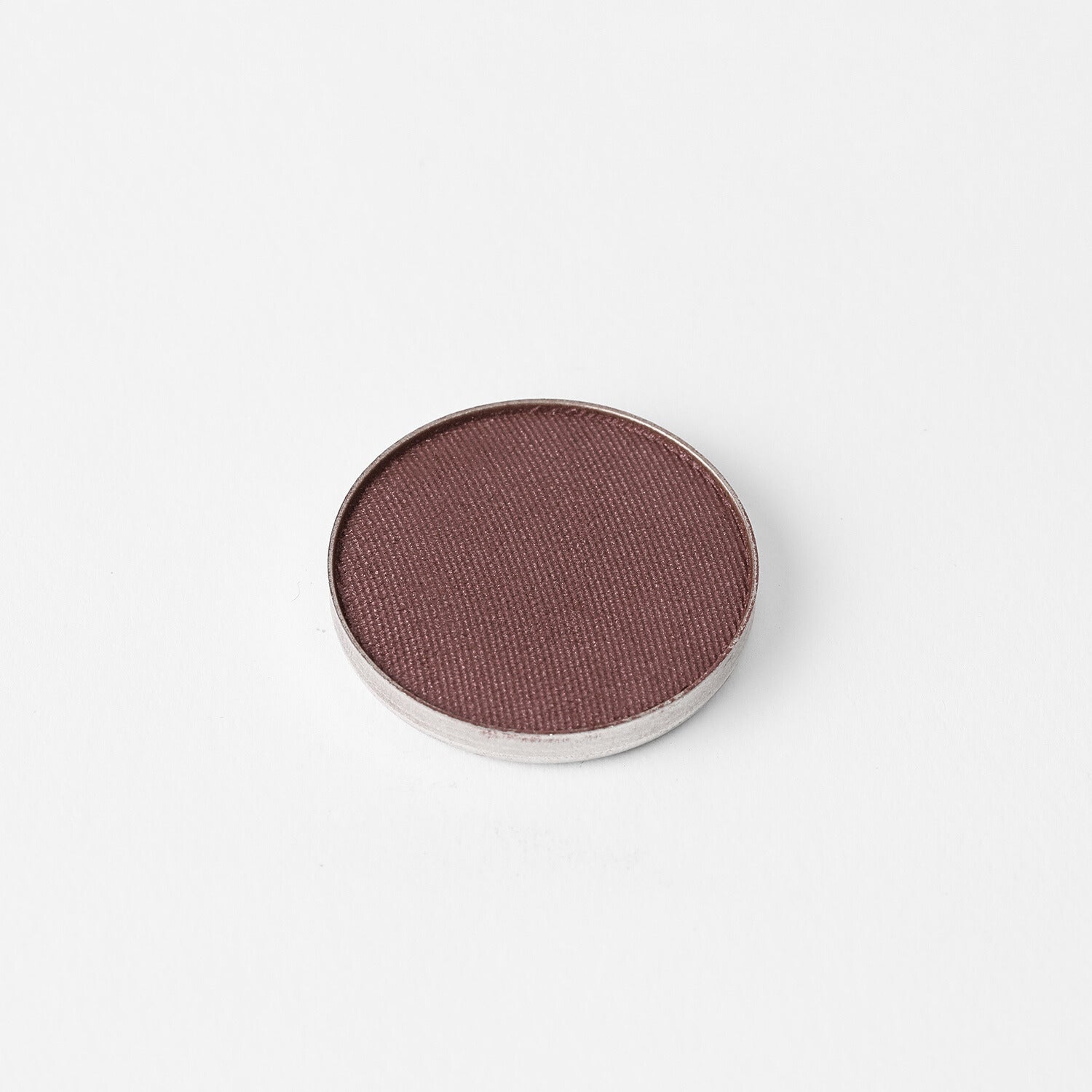 Glow Pressed Eyeshadow in pan showcasing a rich, vegan pigment for shimmering, buildable eye looks.