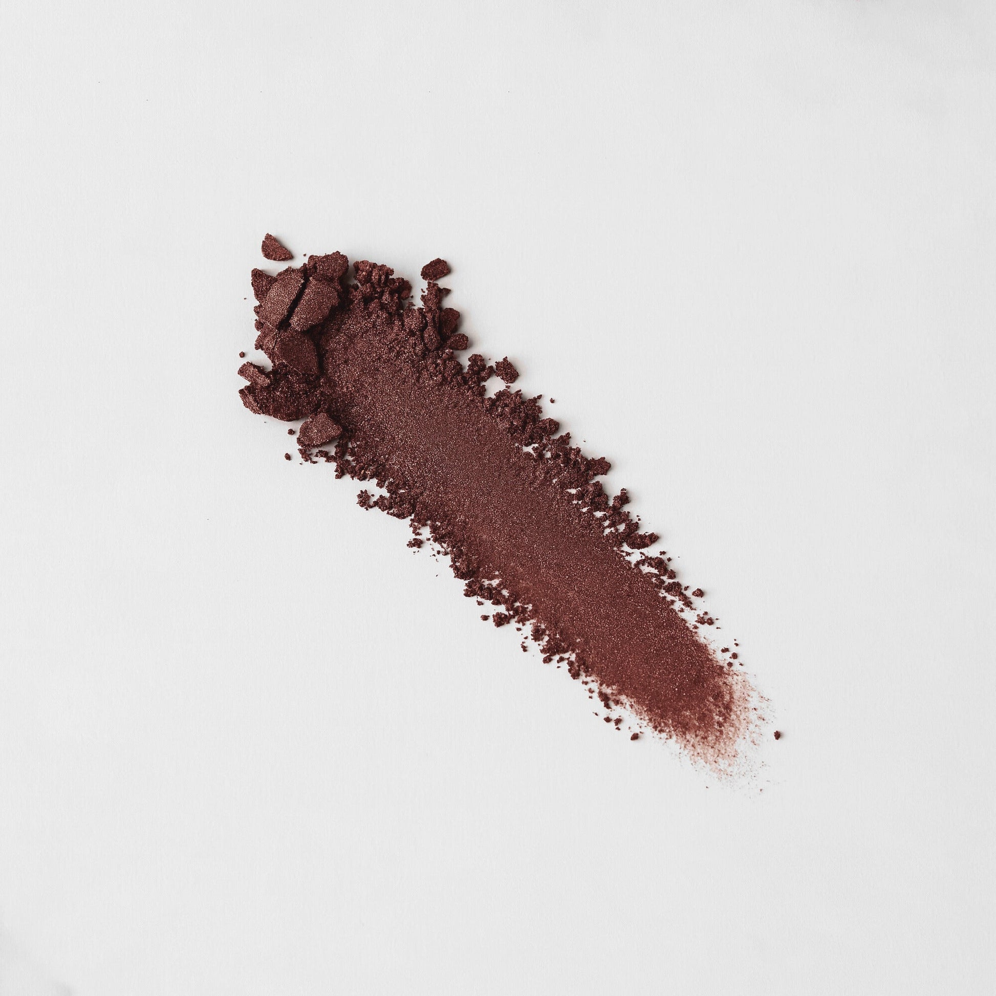 Glow Pressed Eyeshadow in rich vegan pigment, showcasing multi-use, buildable, long-lasting color ideal for shimmer and definition.