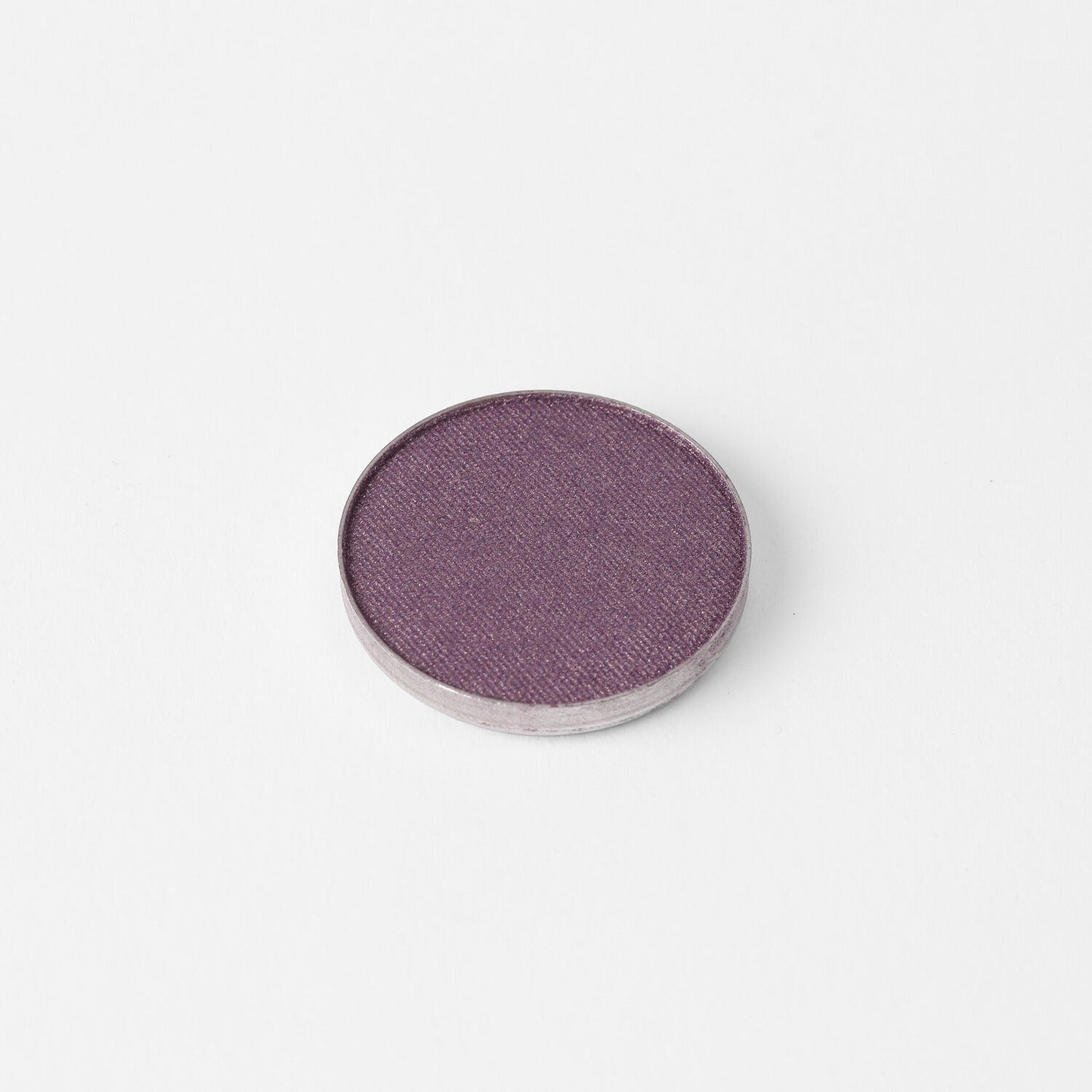 Single pan of Glow Pressed Eyeshadow in a rich, vibrant purple shade on a white background.