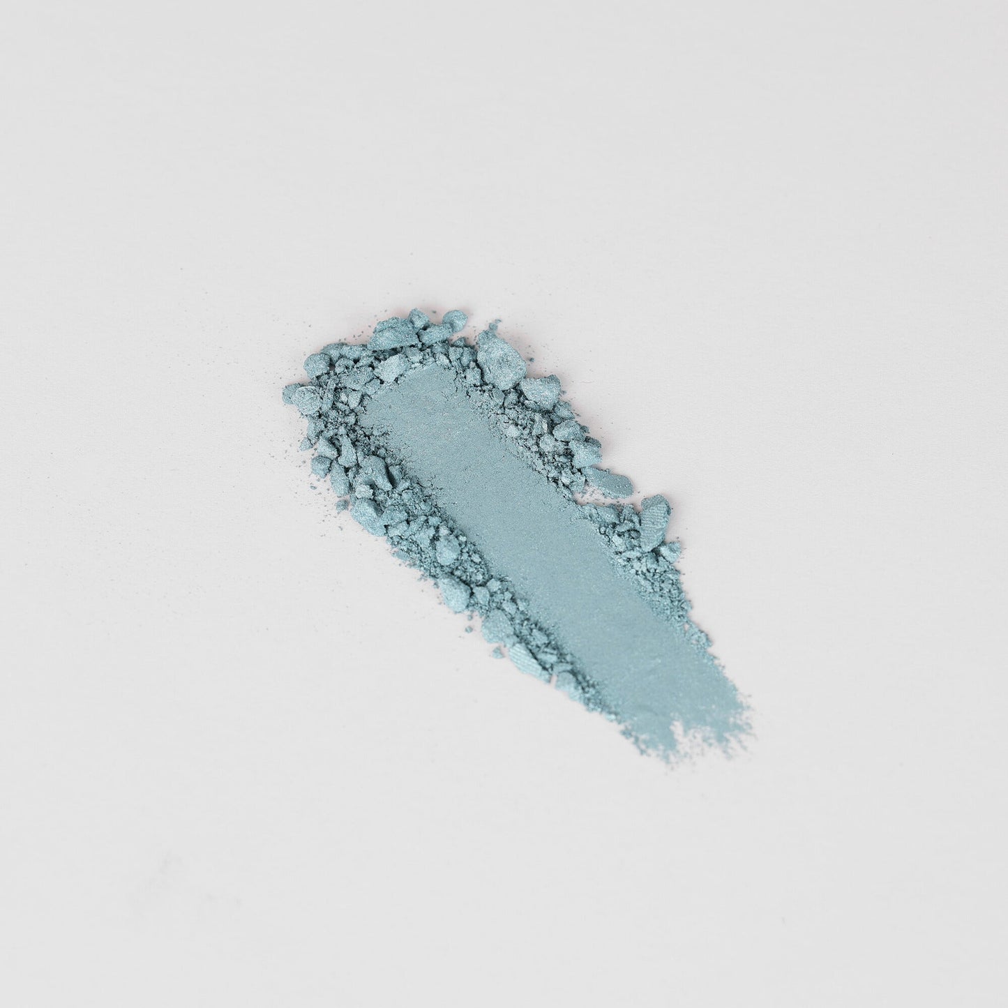 Glow Pressed Eyeshadow swatch in blue shade showcasing smooth, blendable, and buildable vegan pigments for bold or subtle looks.