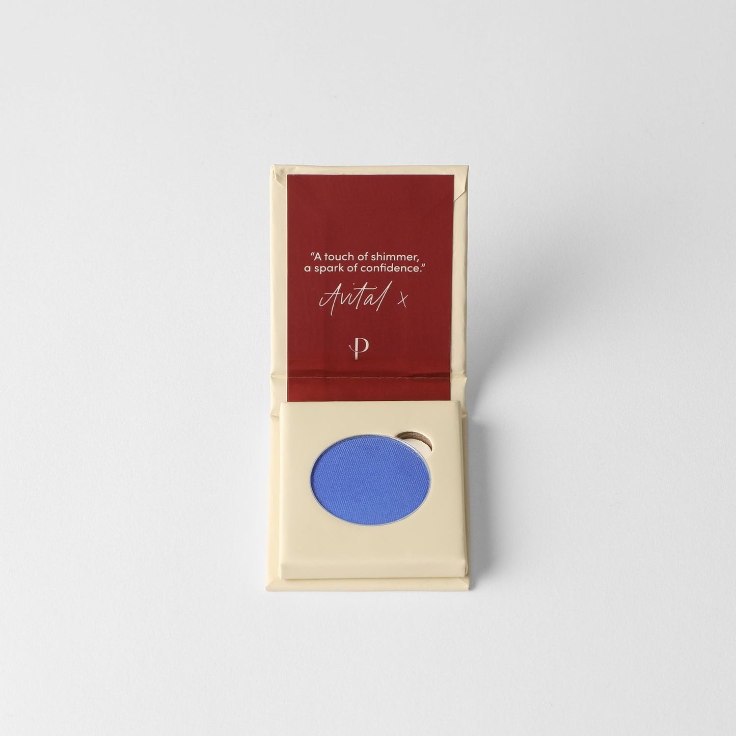 Glow Pressed Eyeshadow in vibrant blue, open palette showing rich vegan pigment, ideal for creating a luminous eye makeup look.