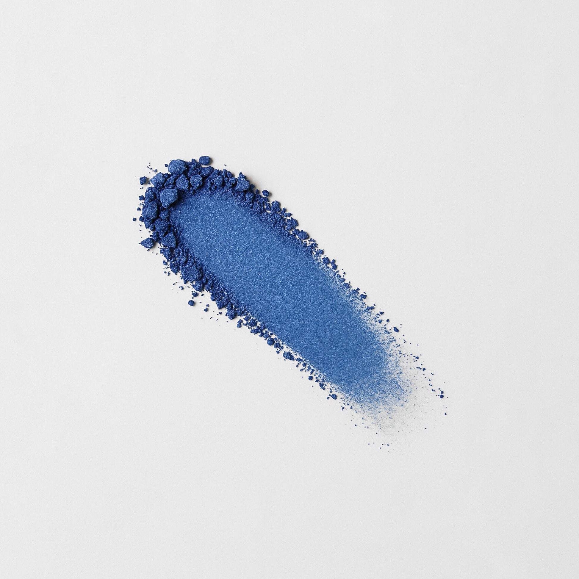 Blue Glow Pressed Eyeshadow swatch with rich vegan pigments, offering a bold luminous finish.