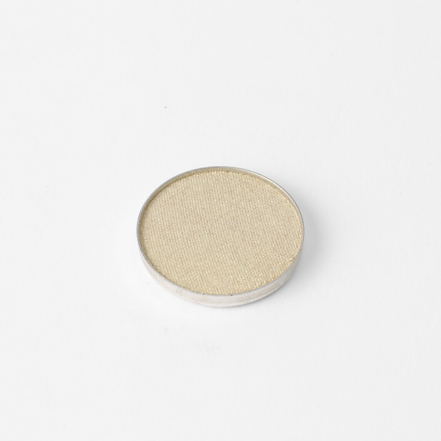 Glow Pressed Eyeshadow single pan in soft shimmer beige, showcasing a luminous finish suitable for layering, lining, and defining.