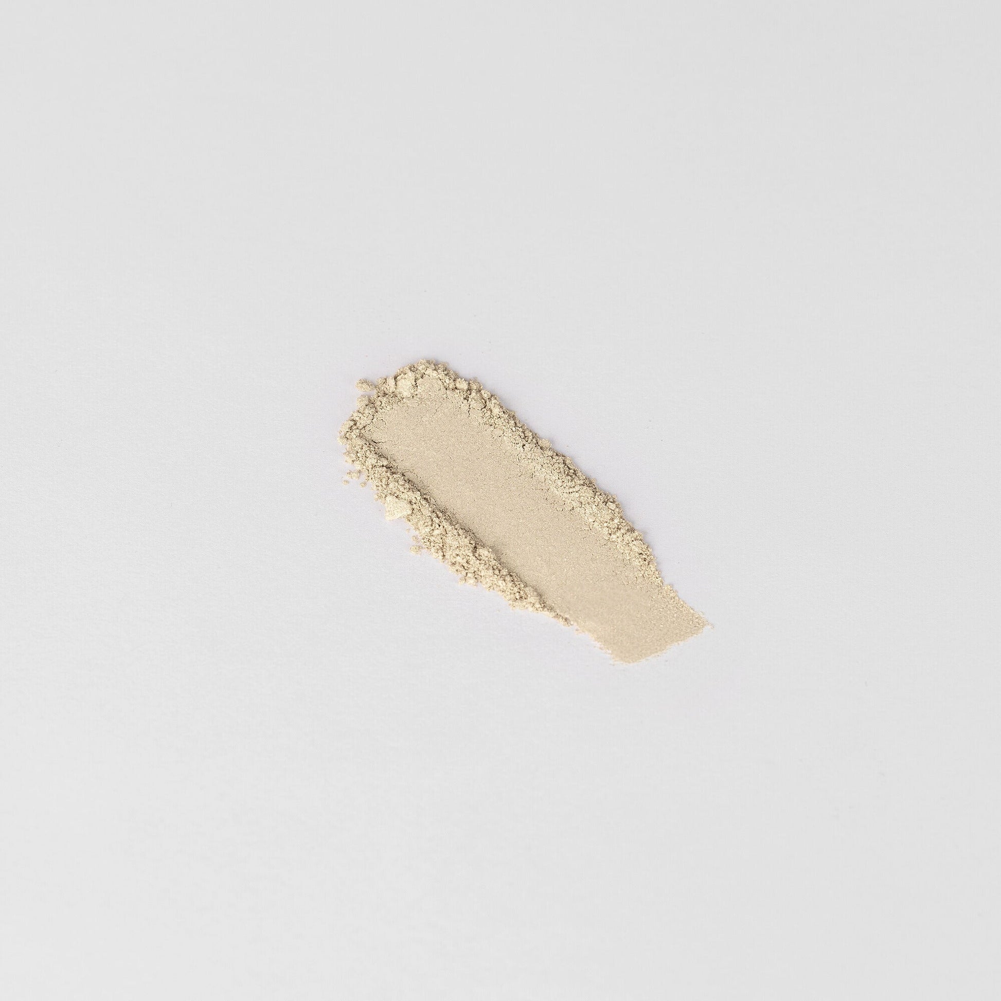 Glow Pressed Eyeshadow swatch showing luminous and smooth texture.