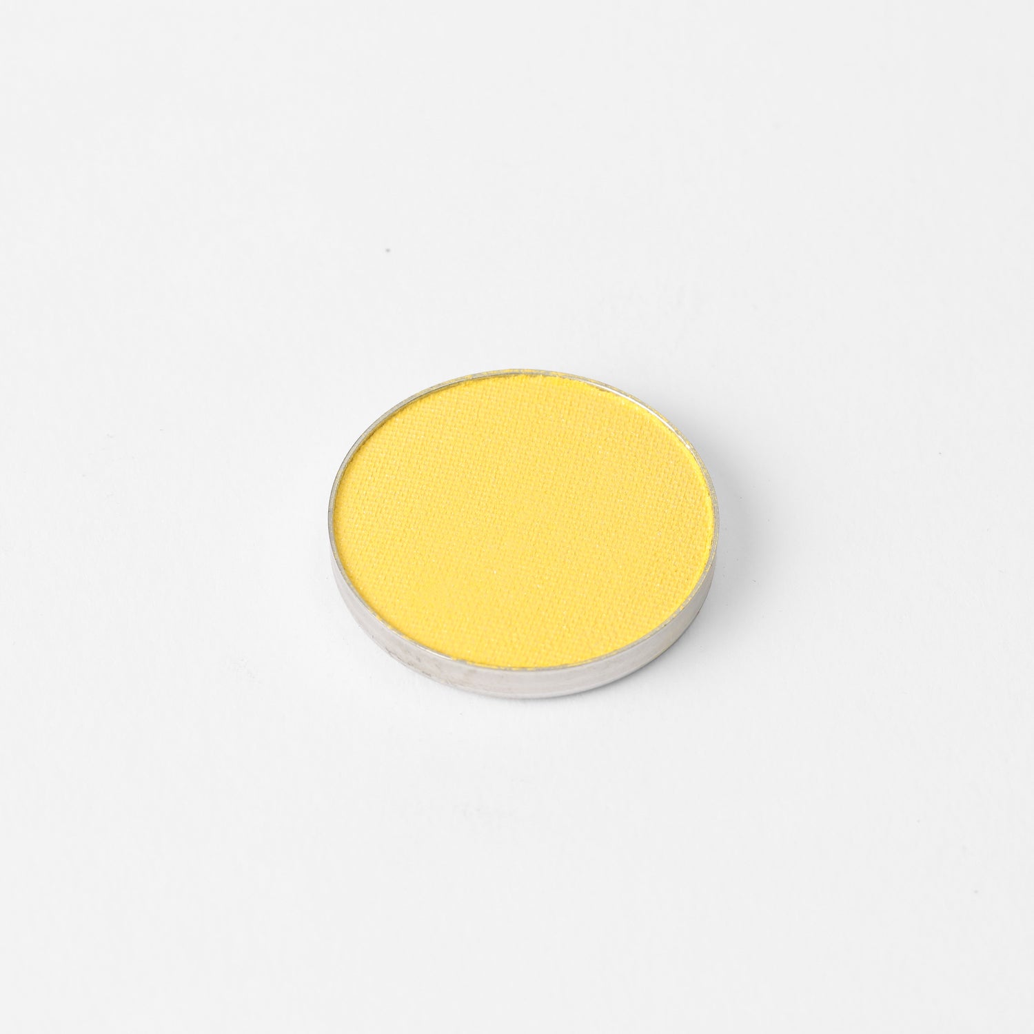 Glow Pressed Eyeshadow in vibrant yellow, vegan and long-lasting with buildable shimmer, perfect for defining and illuminating eyes.