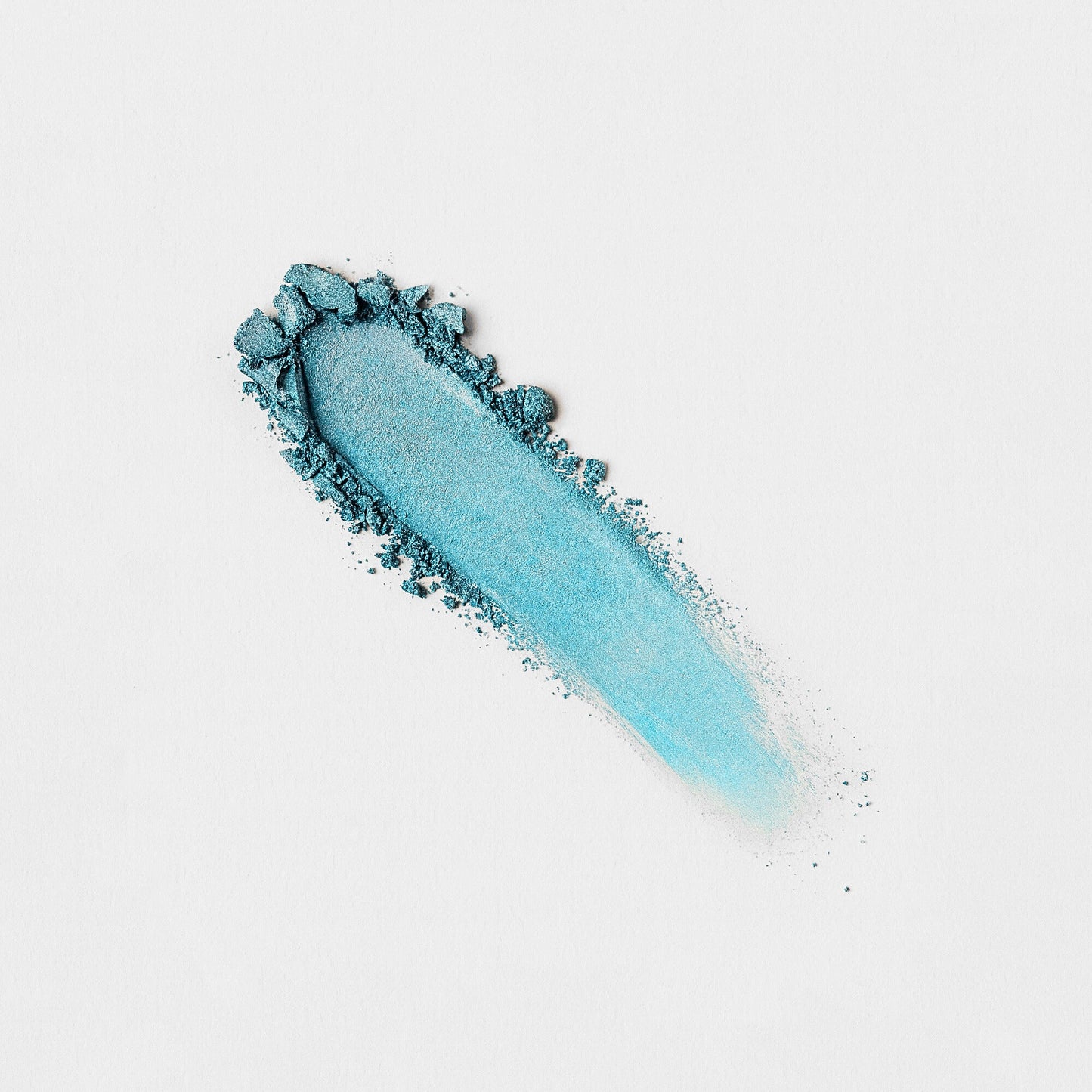Blue swatch of Glow Pressed Eyeshadow with rich vegan pigment and smooth texture