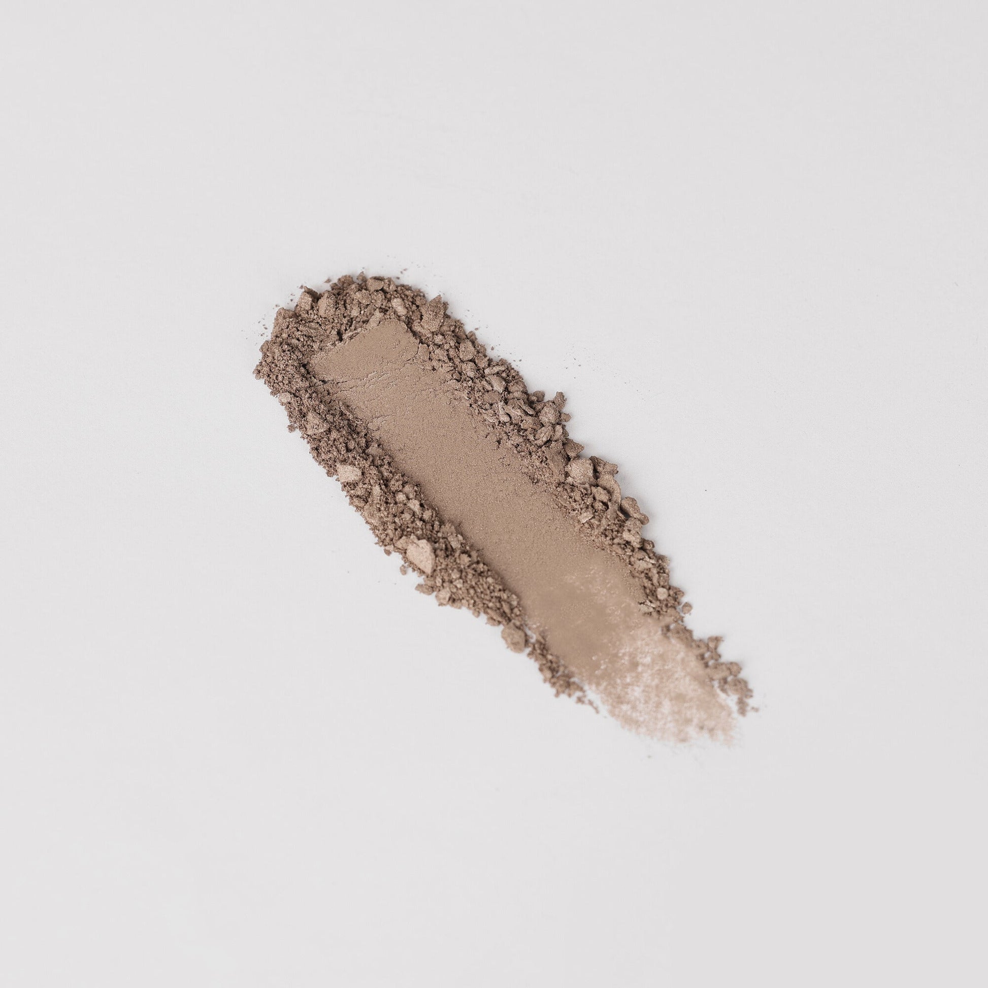 Glow Pressed Eyeshadow swatch showing smooth application and rich vegan pigments on a light background.