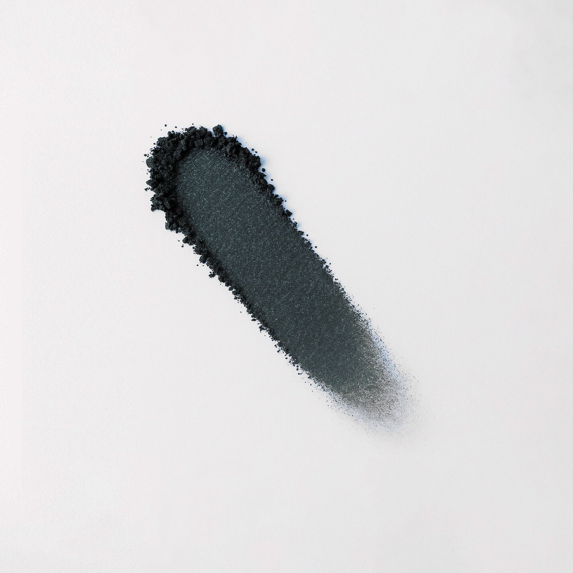 Rich vegan pigment in black from Glow Pressed Eyeshadow, perfect for creating bold, long-lasting eye looks without creasing.