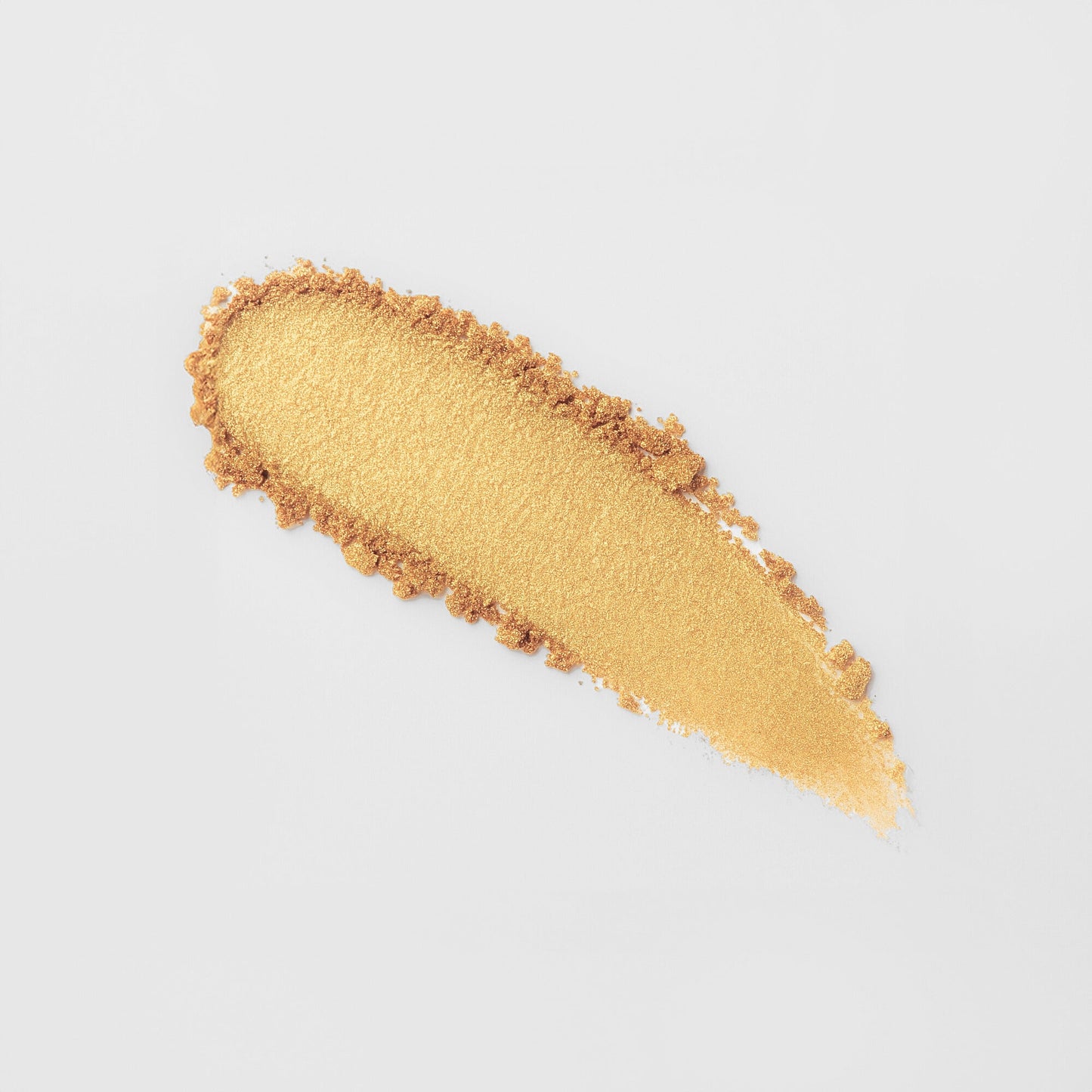 Glow Pressed Eyeshadow swatch showing luminous gold pigment and smooth texture