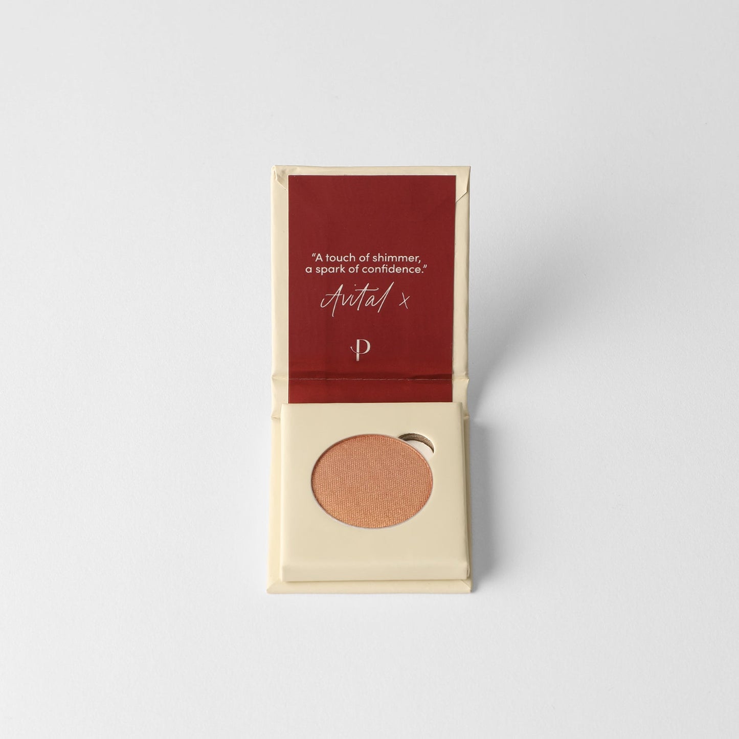 Glow Pressed Eyeshadow in open packaging with shimmer pan, vegan formula for blending and layering.