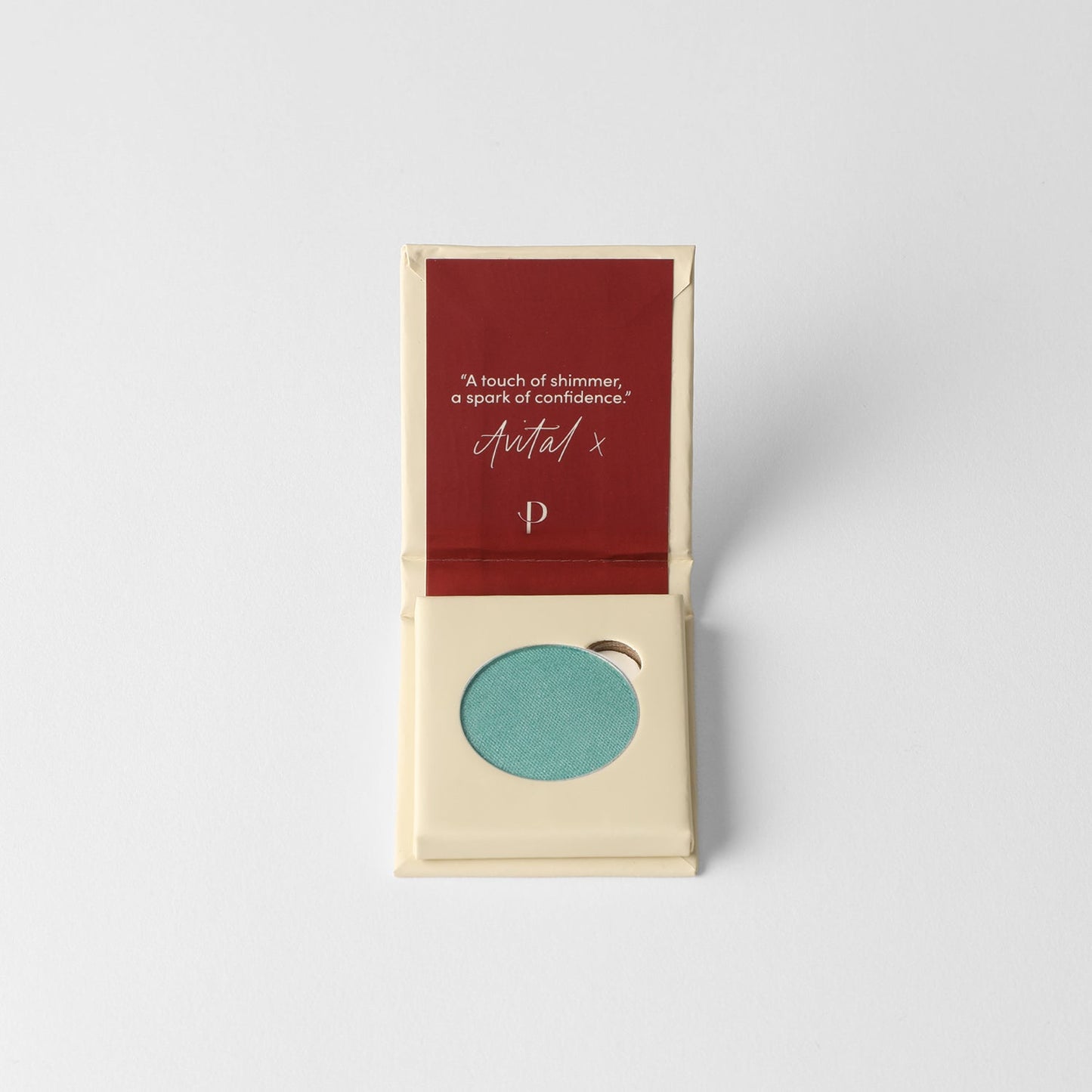 Glow Pressed Eyeshadow in teal, luminous vegan pigment in open compact case