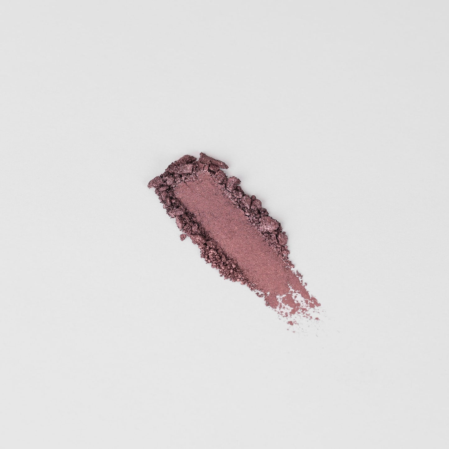 Glow Pressed Eyeshadow swatch in a soft shimmer finish, showcasing rich vegan pigments for a buildable, long-lasting glow.