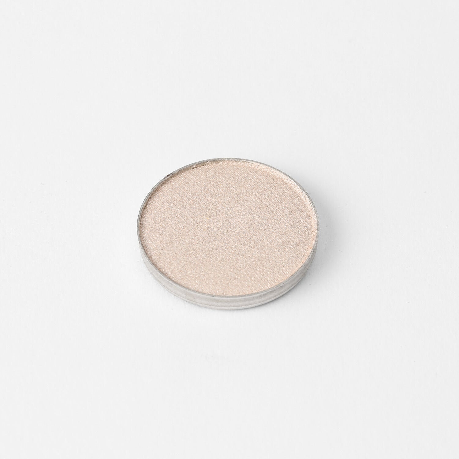 Glow Pressed Eyeshadow in pan showcasing shimmering vegan pigment.