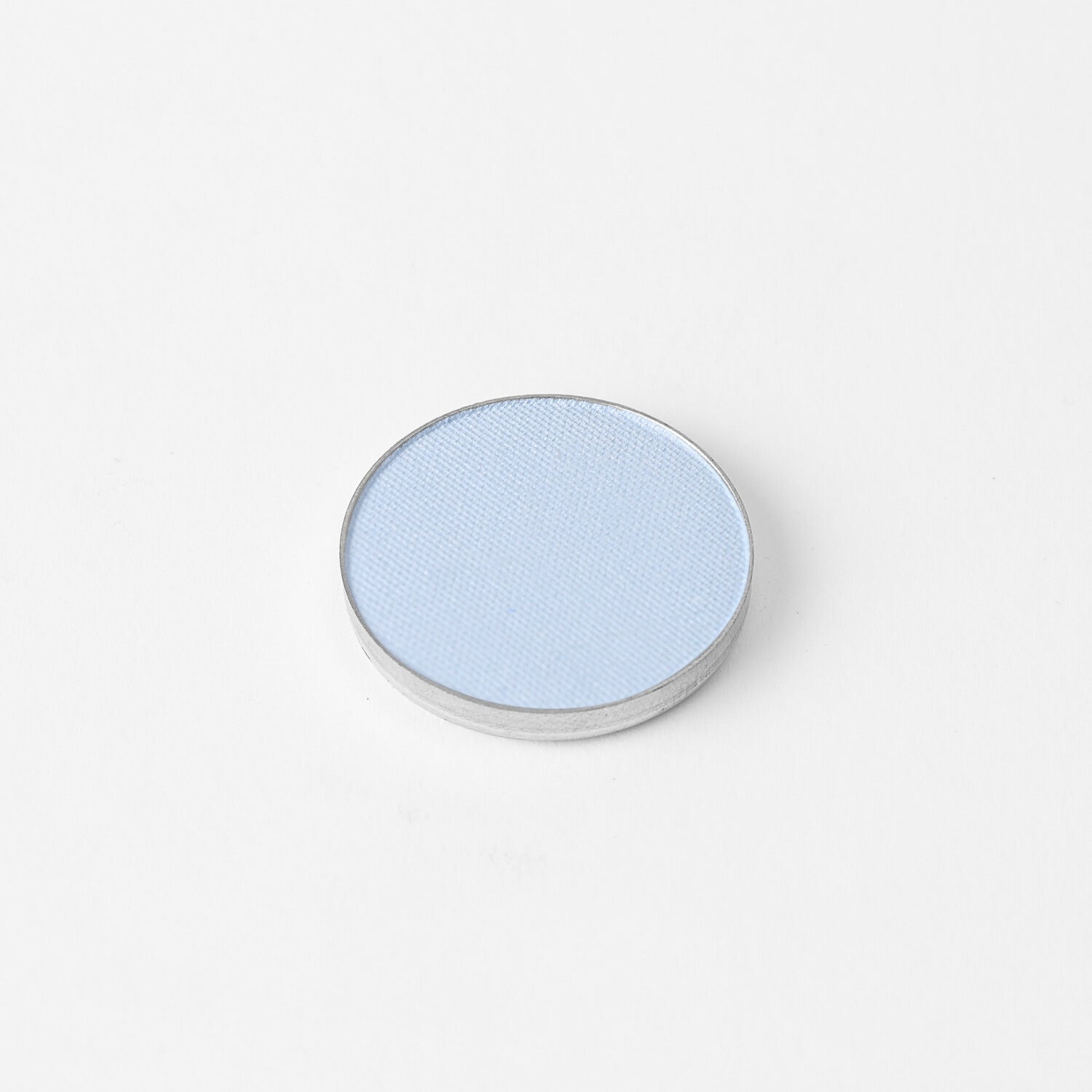Glow Pressed Eyeshadow in light blue, vegan and buildable pressed shadow for versatile eye makeup looks, shown in single pan.