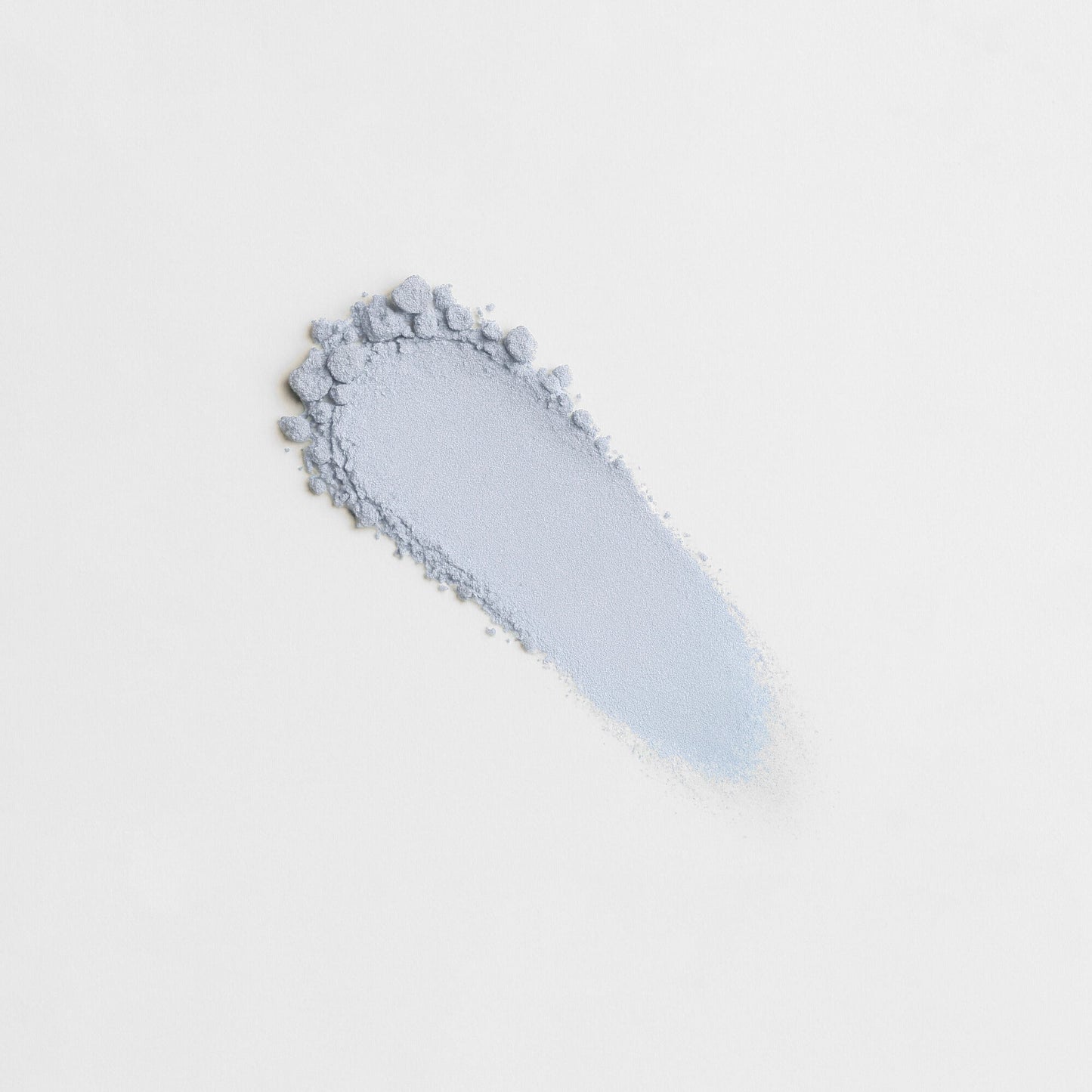 Glow Pressed Eyeshadow swatch in light blue showing smooth, pigmented texture ideal for blending and layering. Vegan and buildable.