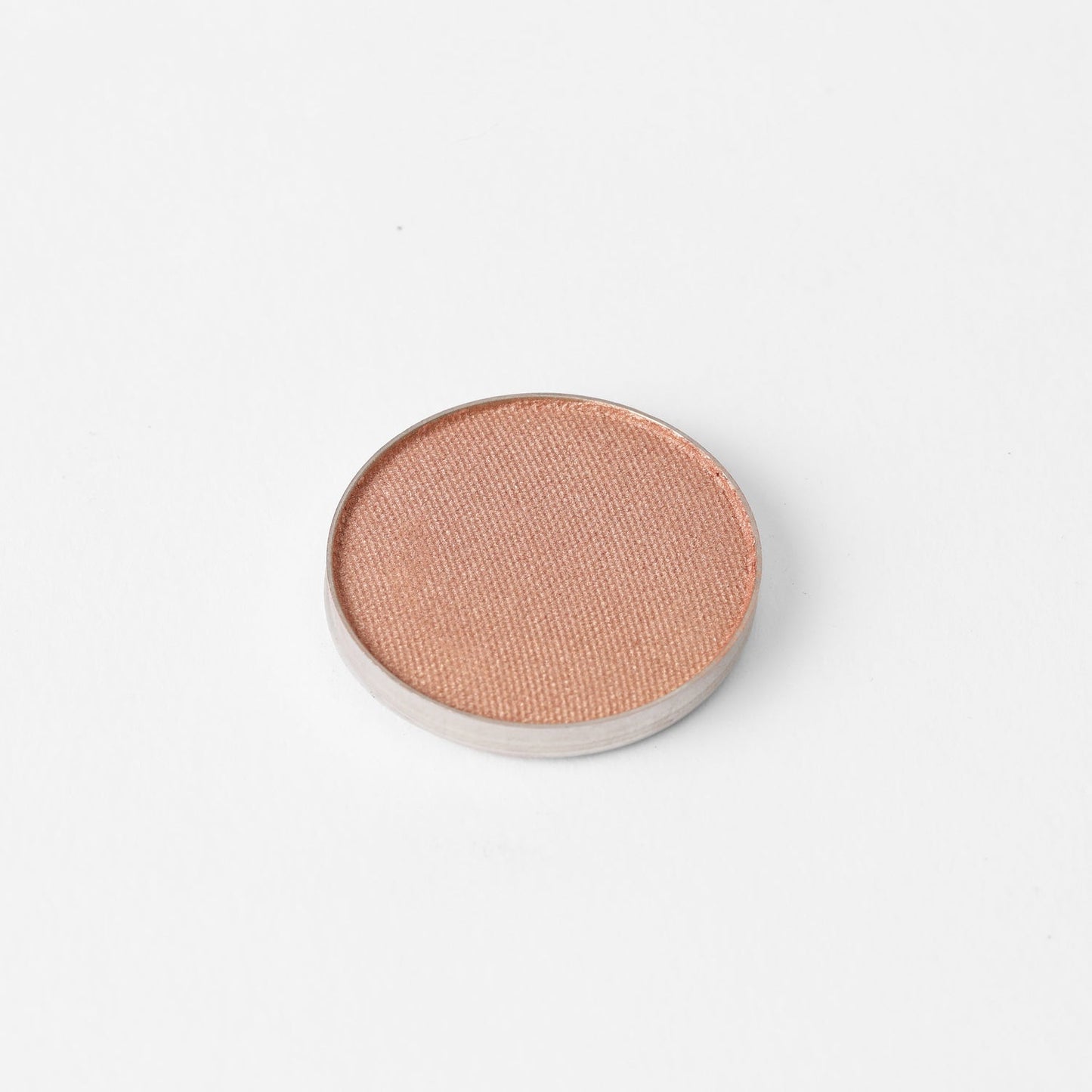 Glow Pressed Eyeshadow pan with luminous shimmer finish, showing rich vegan pigments for smooth application and long-lasting wear.