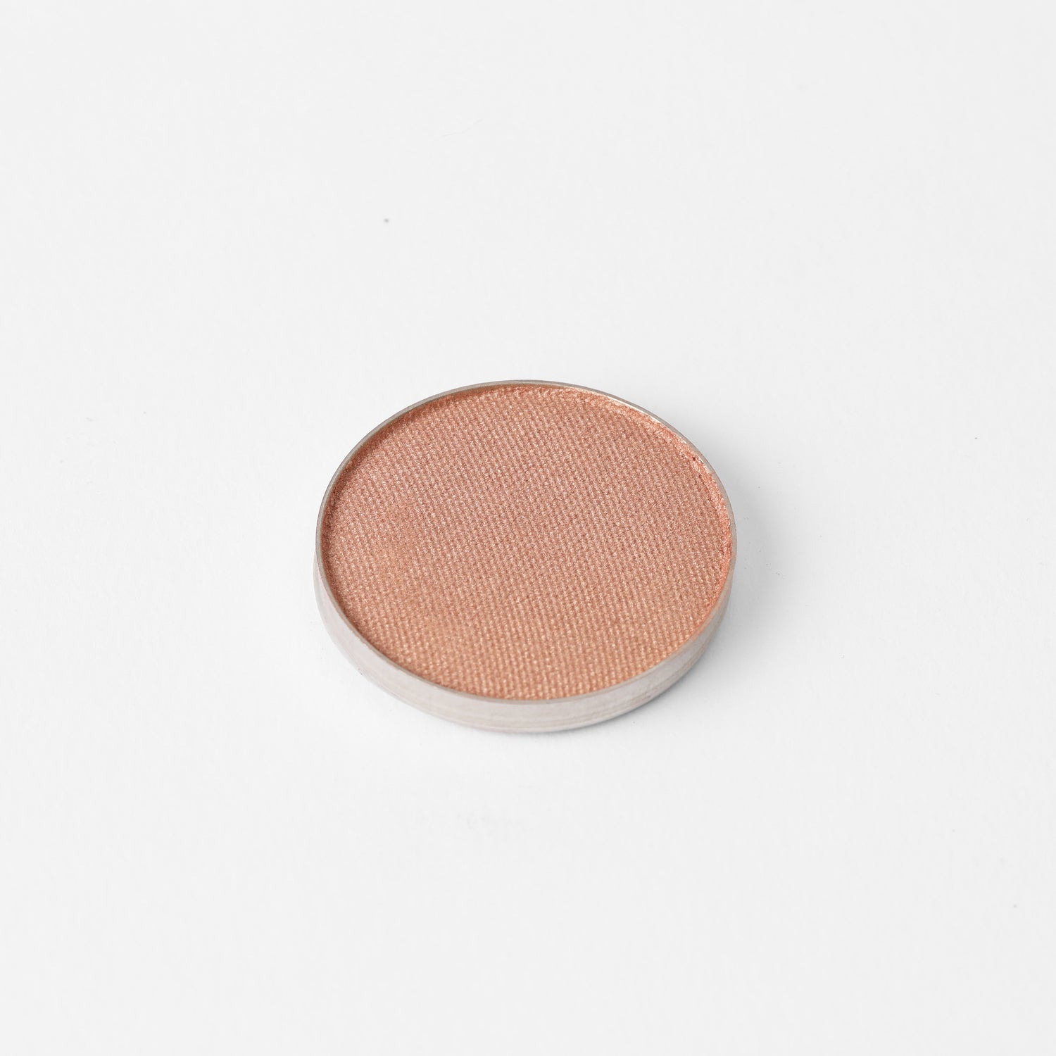 Glow Pressed Eyeshadow pan with luminous shimmer finish, showing rich vegan pigments for smooth application and long-lasting wear.