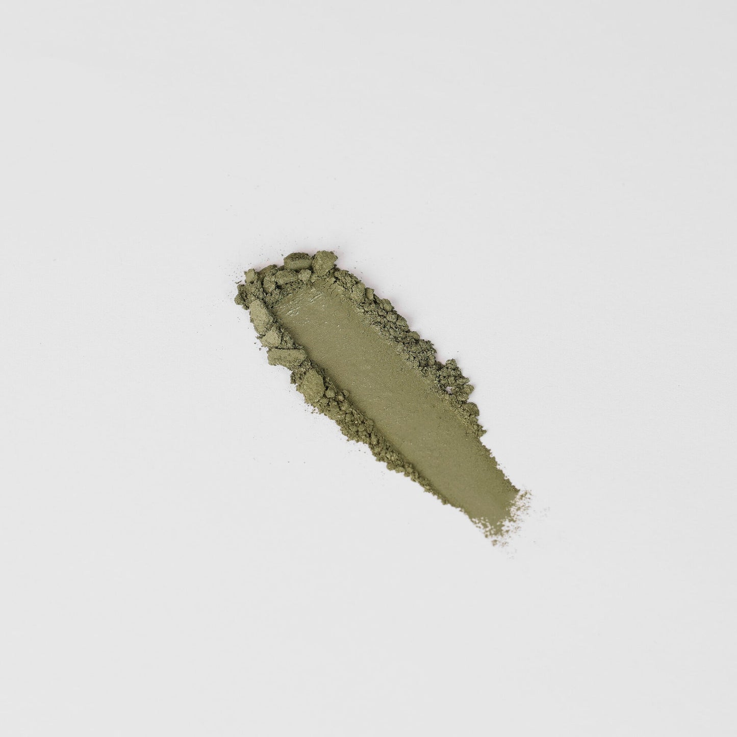 Glow Pressed Eyeshadow in olive shade, showcasing rich texture and smooth application for a luminous, subtle to bold look.