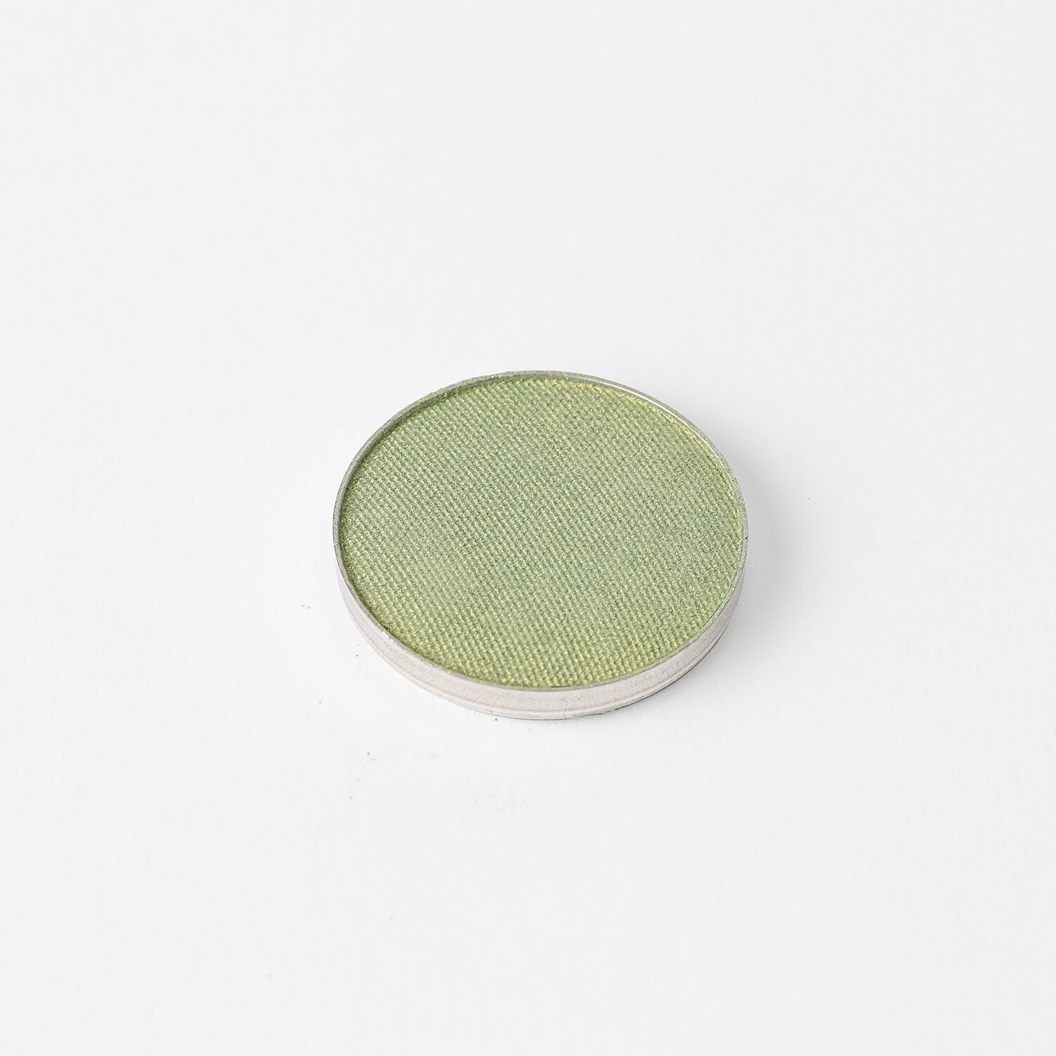 Glow Pressed Eyeshadow in luminous green shade, single pan. Vegan, blendable, long-lasting eyeshadow for a subtle to bold makeup look.