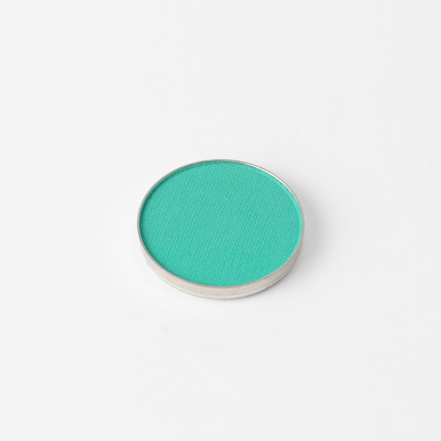 Glow Pressed Eyeshadow single pan in teal, rich vegan pigment for luminous and buildable color