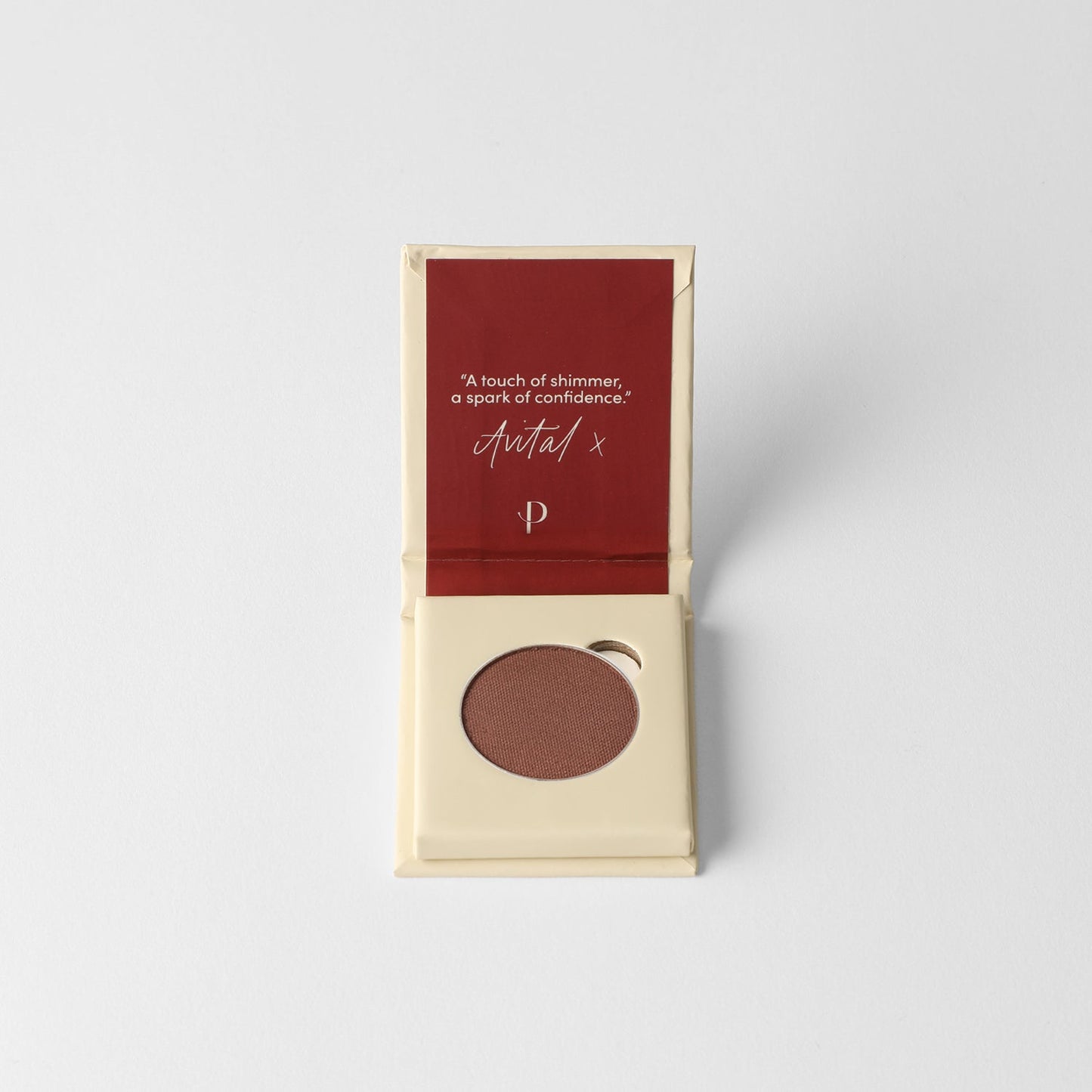 Glow Pressed Eyeshadow in packaging, showcasing rich vegan pigments for a luminous look. Buildable and blendable makeup product.