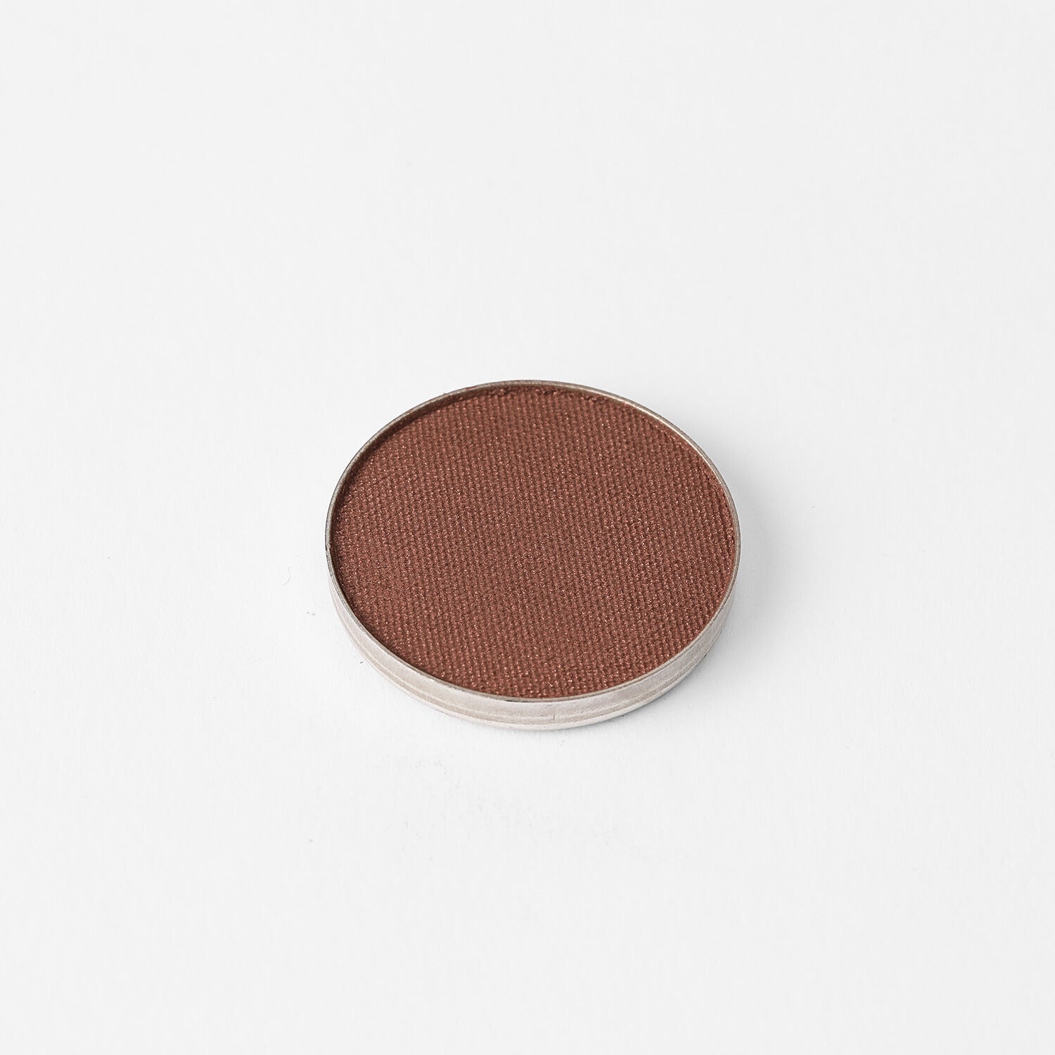 Glow Pressed Eyeshadow in a round pan showcasing rich vegan pigments for smooth application and a luminous finish.