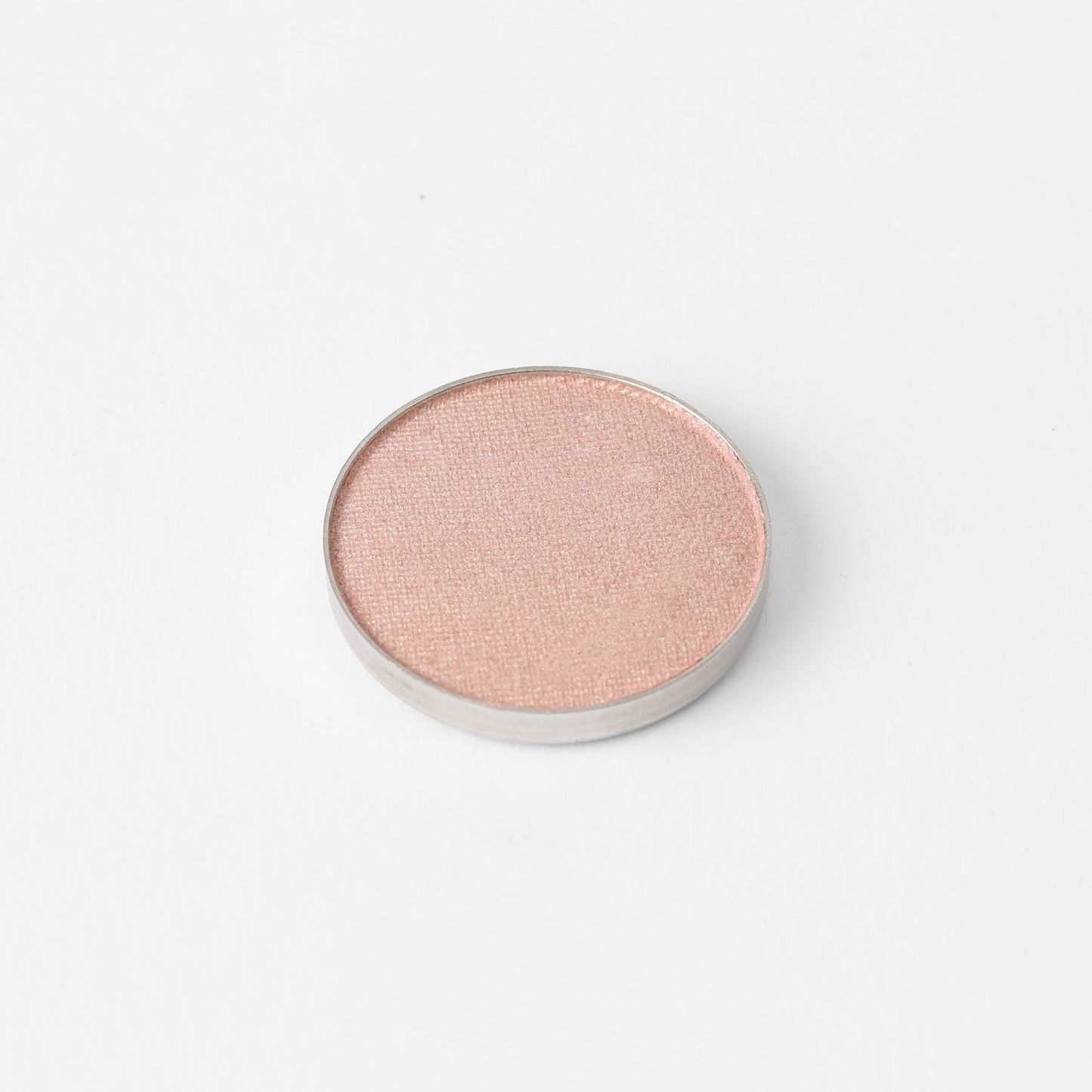 Glow Pressed Eyeshadow in a round pan, luminous vegan pigment