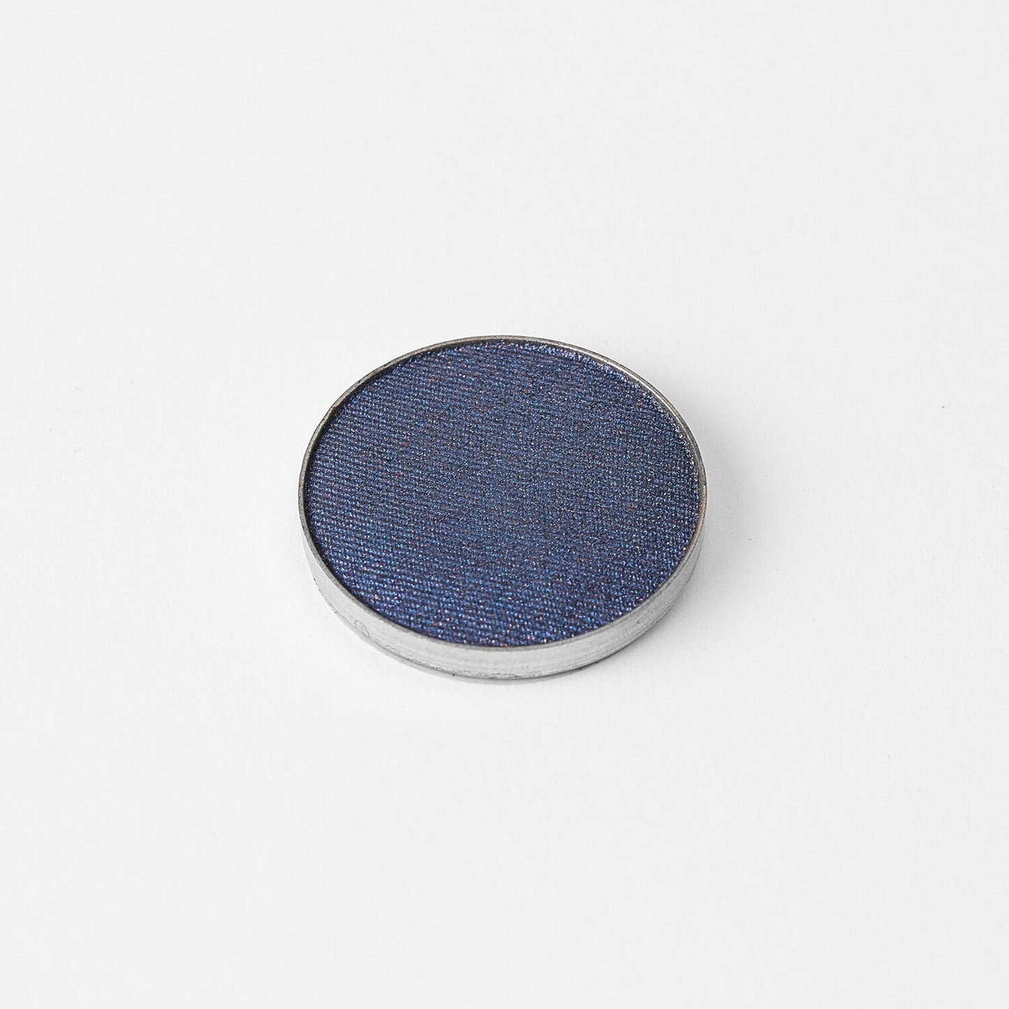 Glow Pressed Eyeshadow in metallic blue on white background