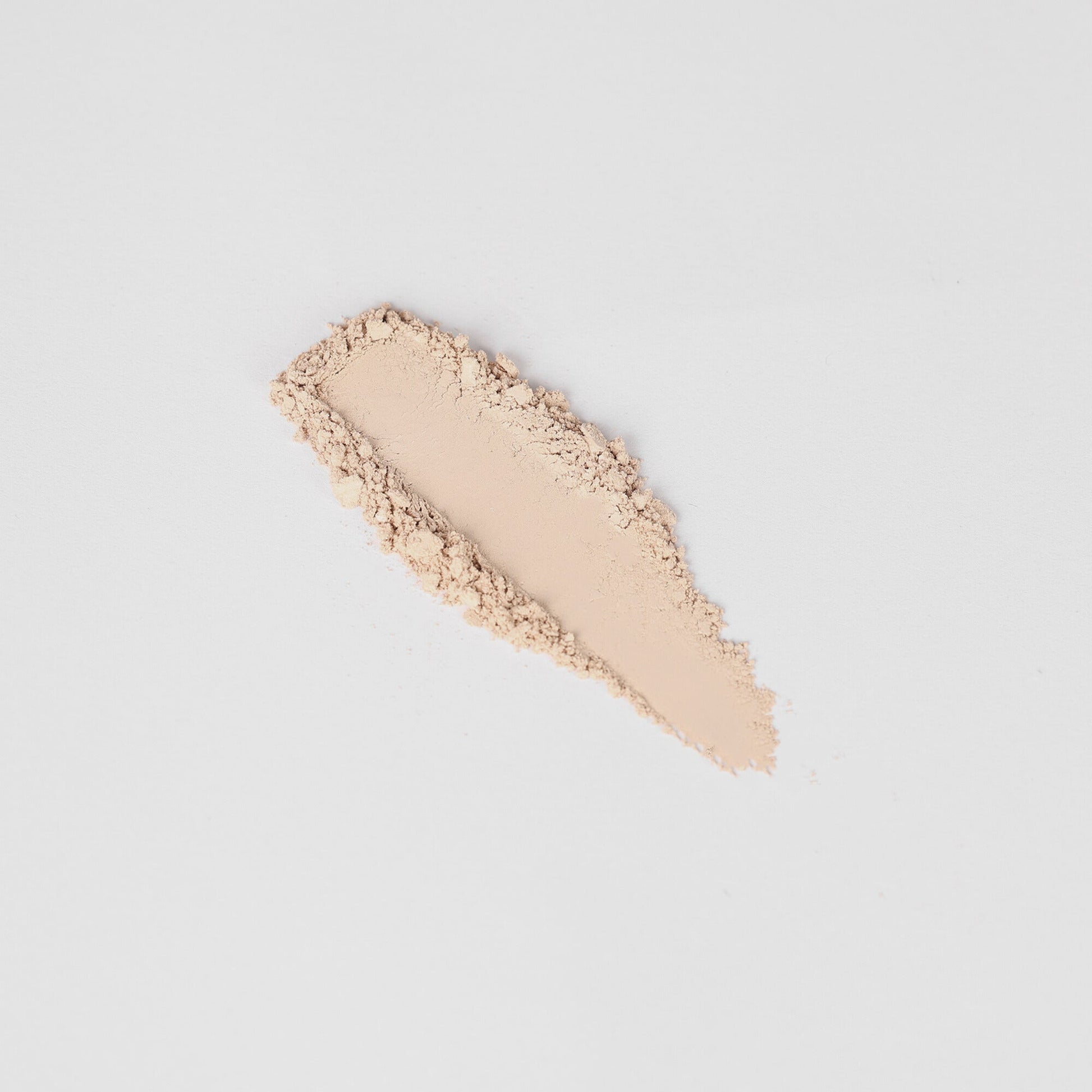 Glow Pressed Eyeshadow swatch showing smooth blendable texture in a light shimmer shade on a white background.