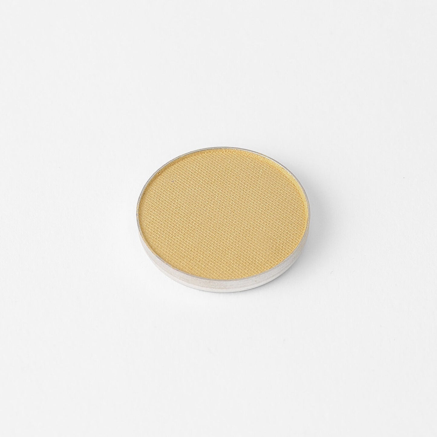 Glow Pressed Eyeshadow with rich, vegan pigments in a single round pan for shimmering and buildable eye color.