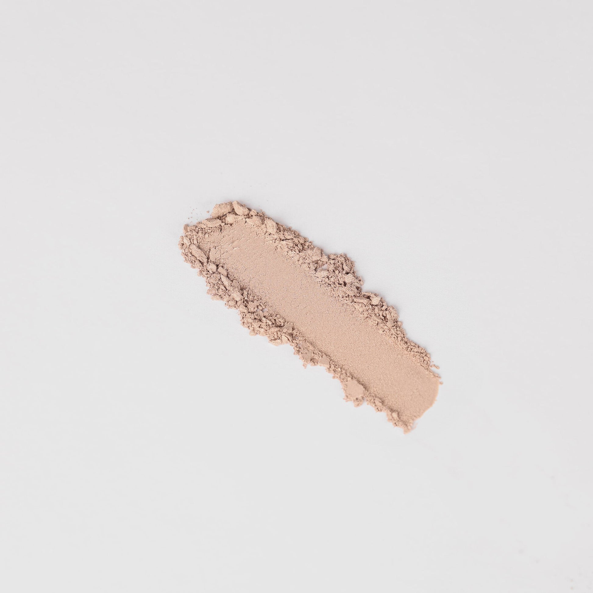 Swatch of Glow Pressed Eyeshadow showing smooth, luminous vegan pigment on a neutral background.