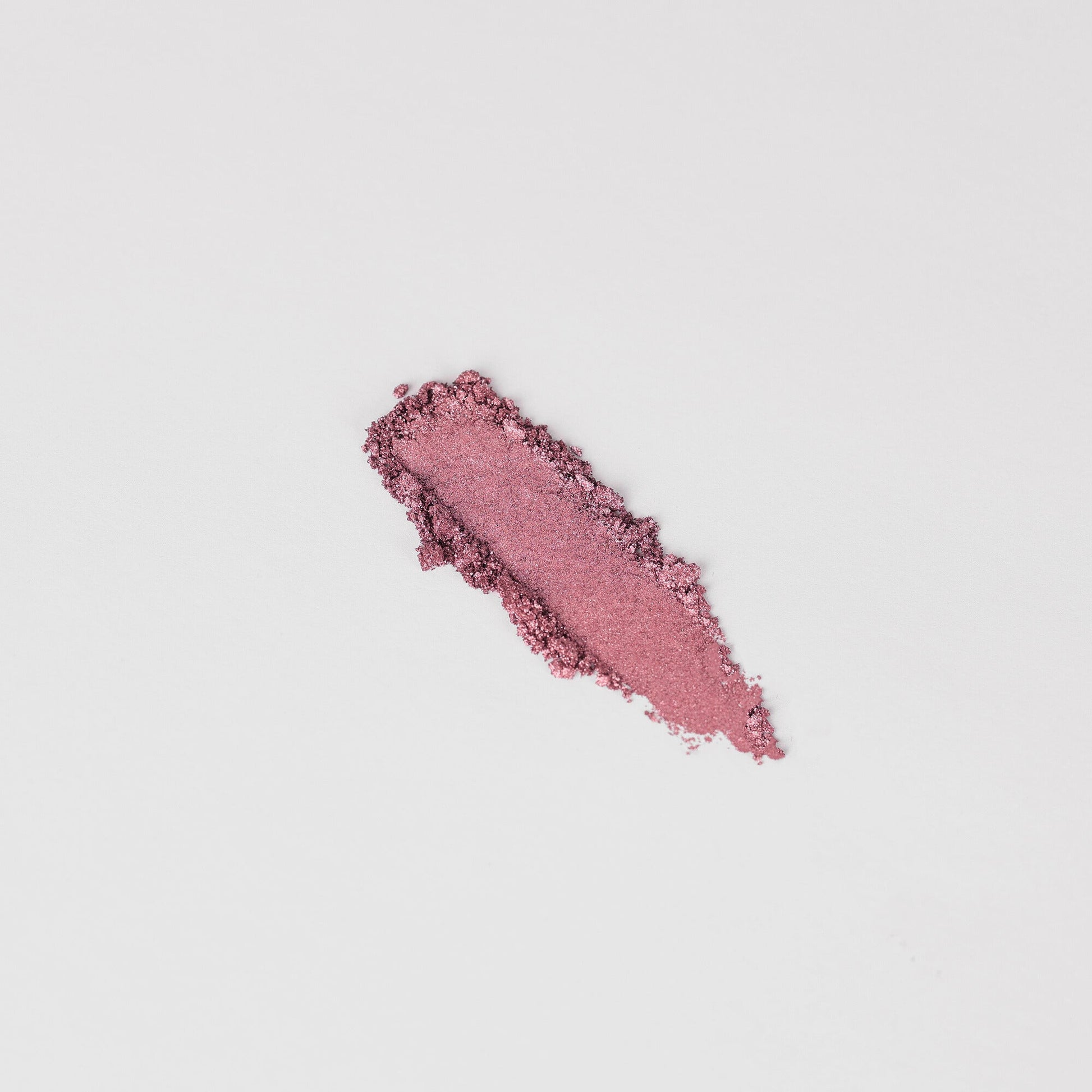 Glow Pressed Eyeshadow crushed sample showing pink pigment texture