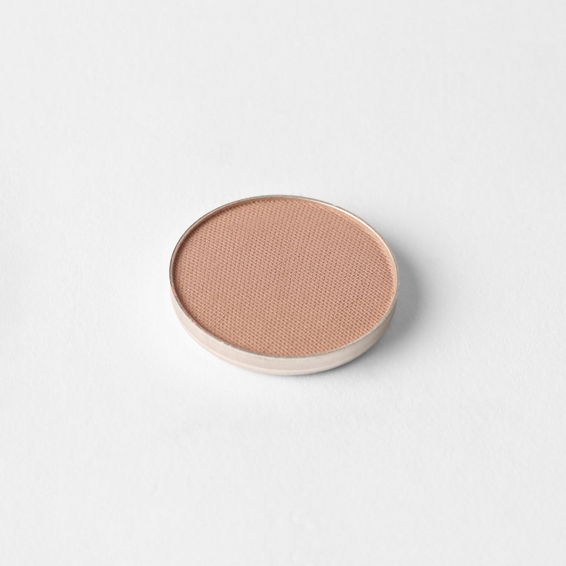 Matte Pressed Eyeshadow in a round pan, showcasing smooth, buildable, vegan pigments that blend seamlessly for versatile eye looks.