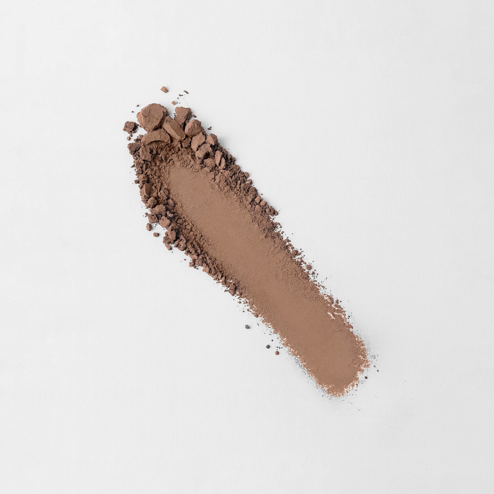 Matte Pressed Eyeshadow in a rich brown shade, perfect for smooth, blendable application on eyelids. Vegan and cruelty-free formula.