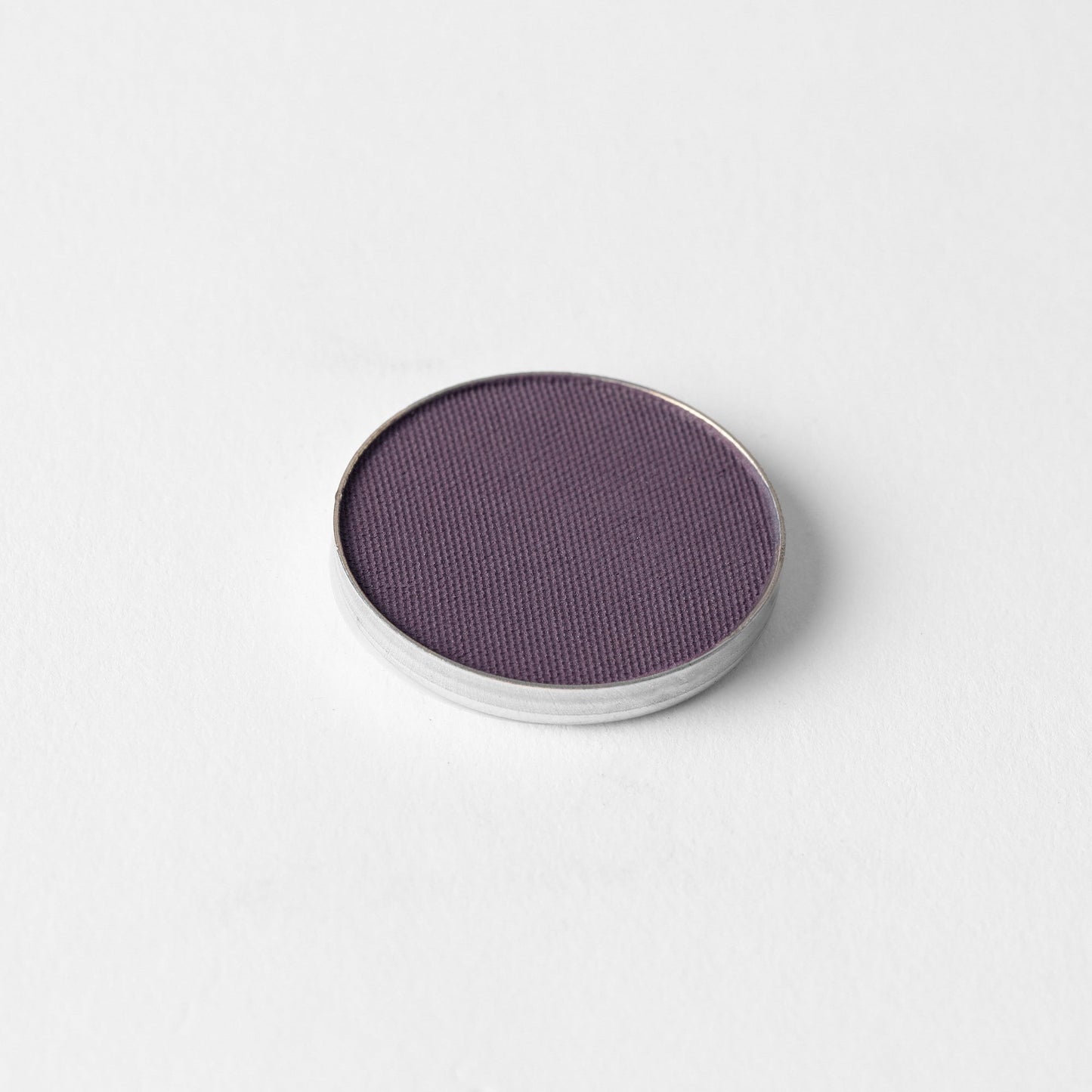 Matte Pressed Eyeshadow in a round single pan, vegan and blendable for seamless eye looks and fits magnetic palettes.